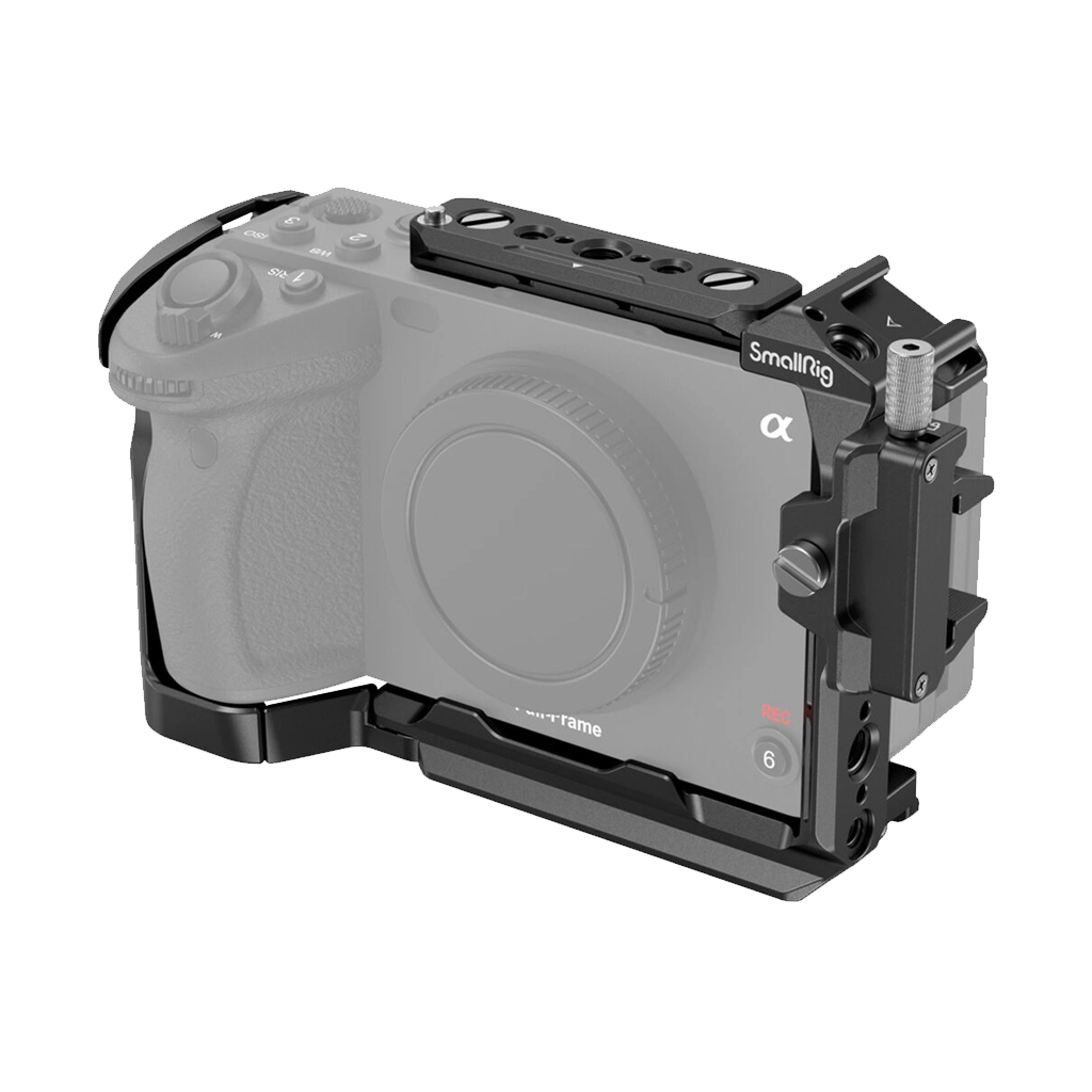 Camera mounted in a SmallRig camera cage with a top handle.