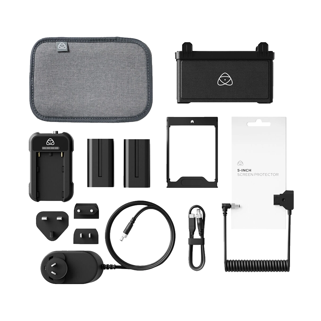A variety of electronic accessories and components, including a gray carrying case, a black power adapter, two batteries, a screen protector, a phone frame, a charging cable, and other small electronic parts, all laid out on a flat surface.