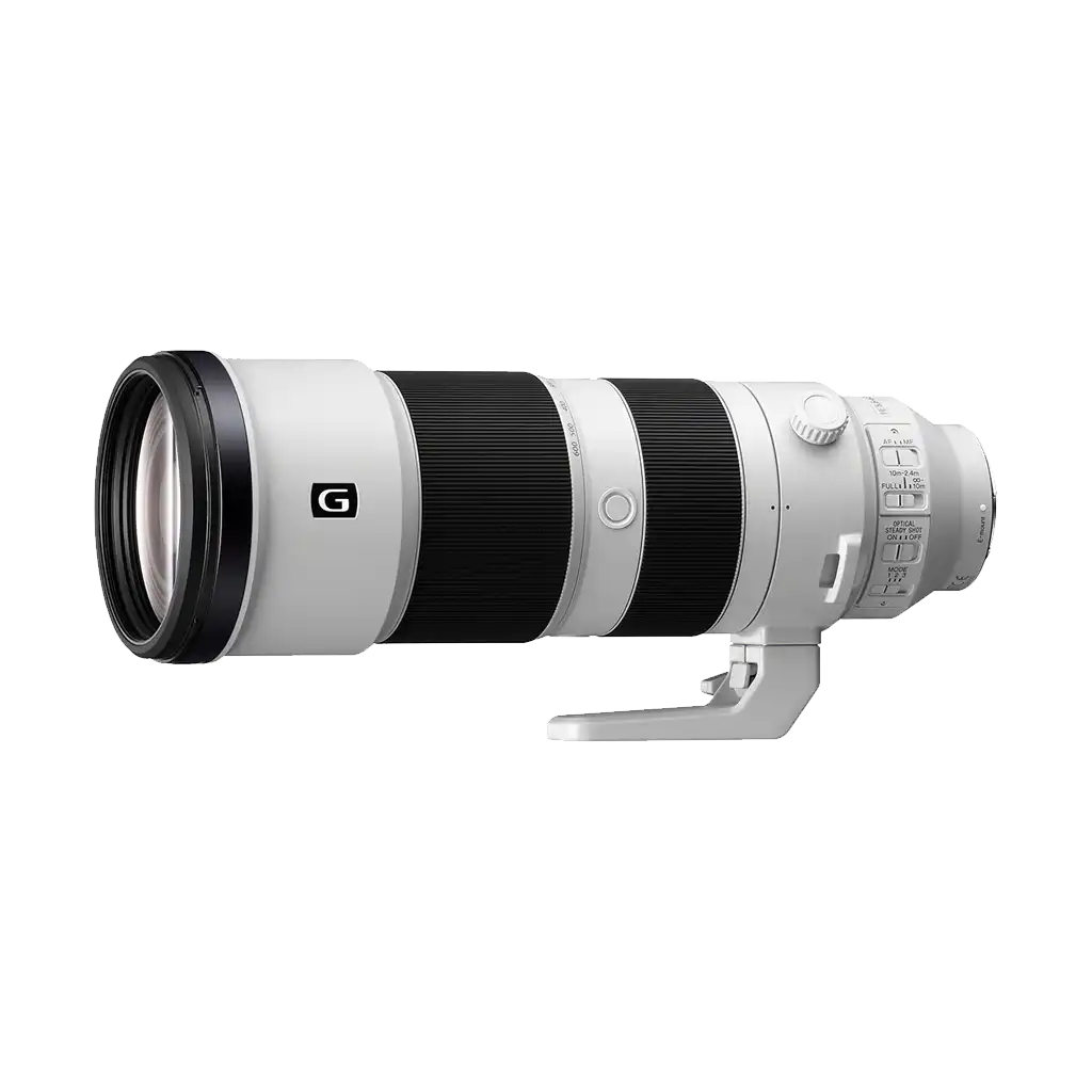 A white telephoto camera lens with black zoom rings and focus rings, mounted on a white tripod mount against a black background.