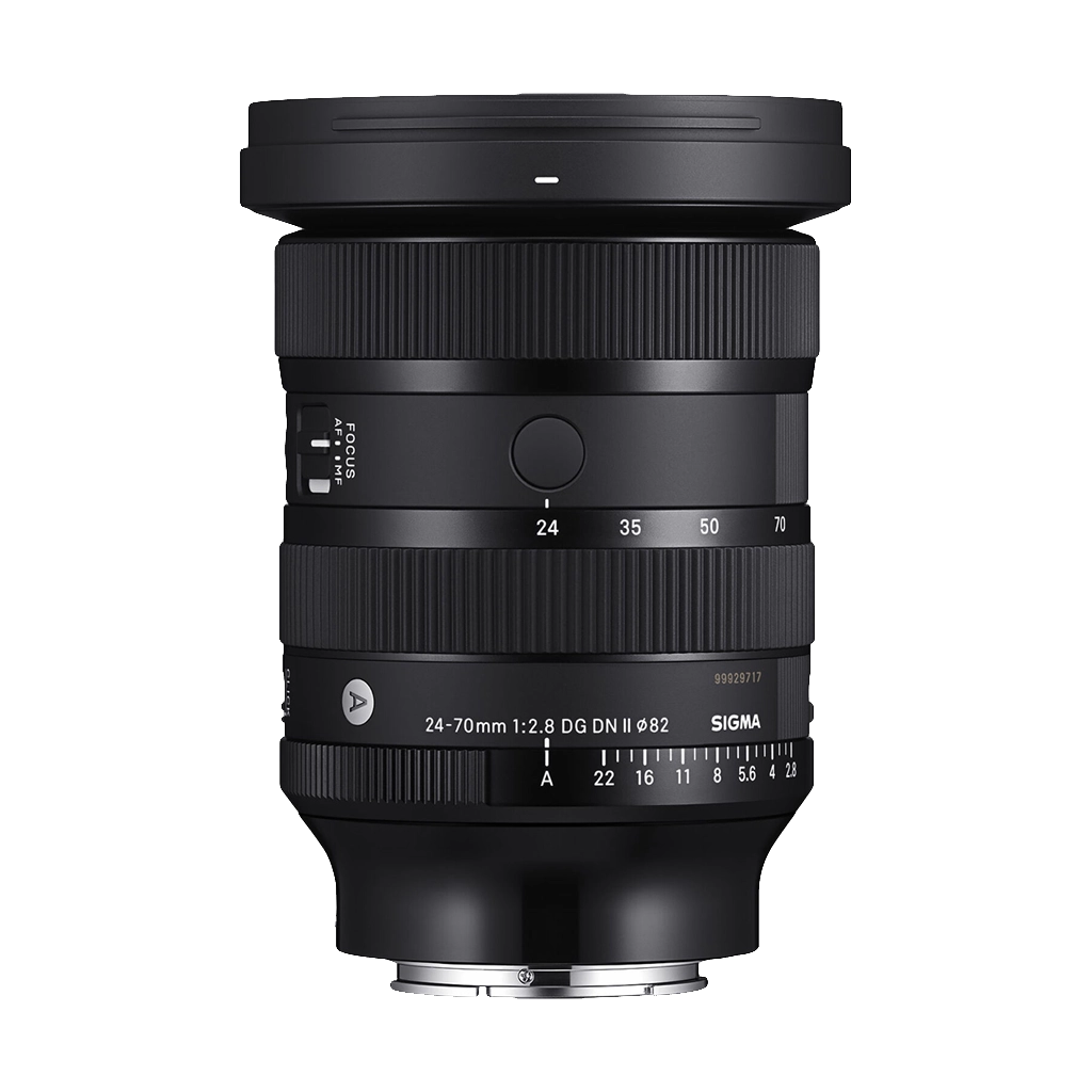 A Sigma 24-70mm f/2.8 DG DN lens with focus and zoom rings and various markings on a black background.