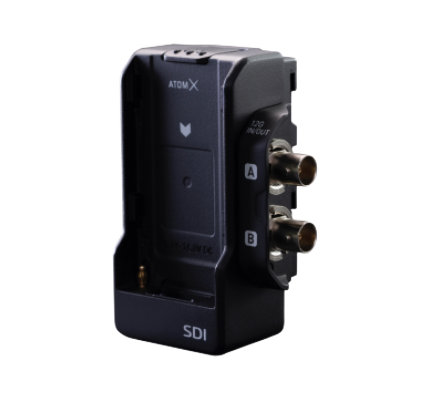 An SDI media converter with BNC connectors for video input and output, labeled 'ATOM X' and 'SDI'.