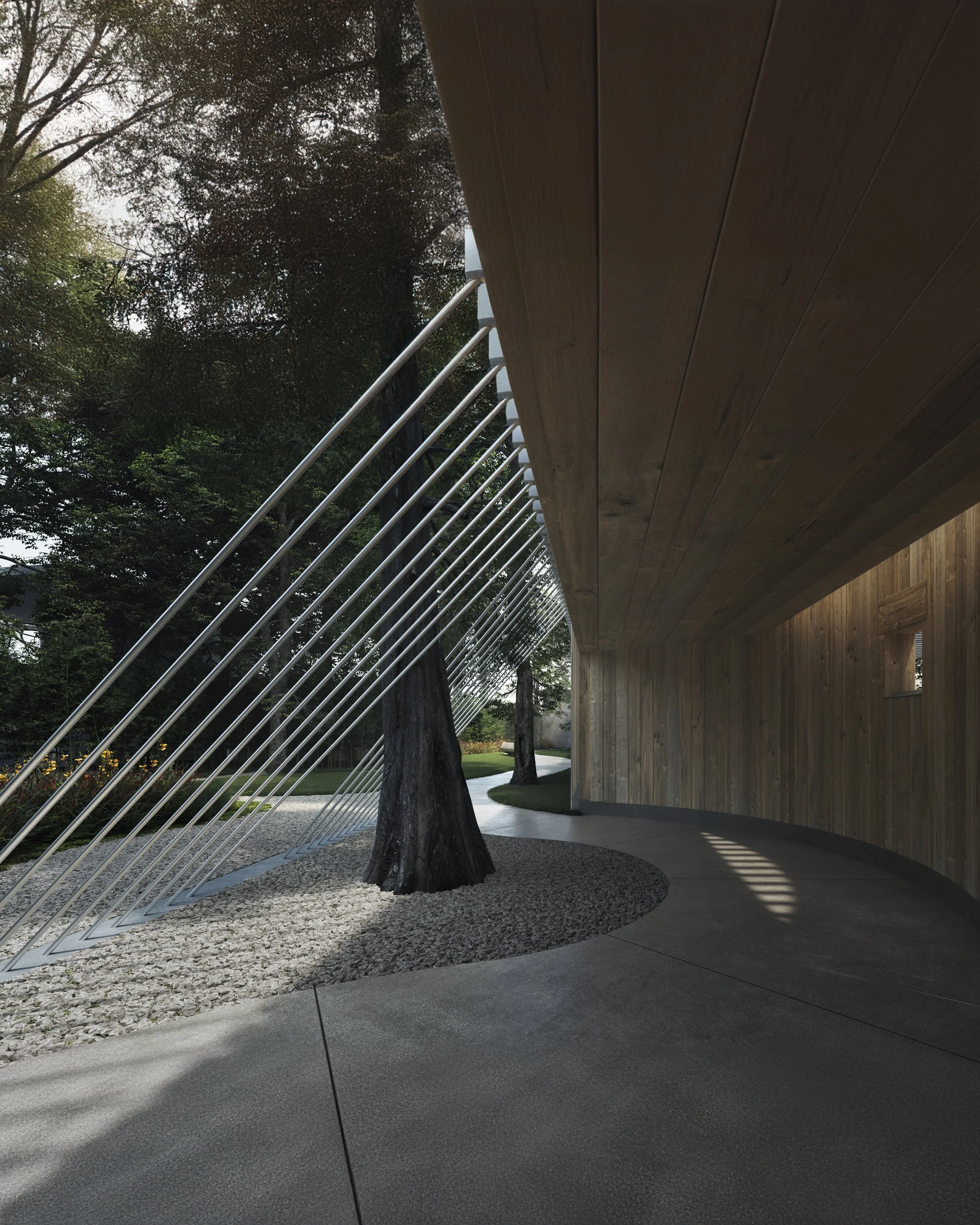 Modern outdoor architectural design featuring a wooden overhang, metal railings, trees, gravel, and a winding pathway.