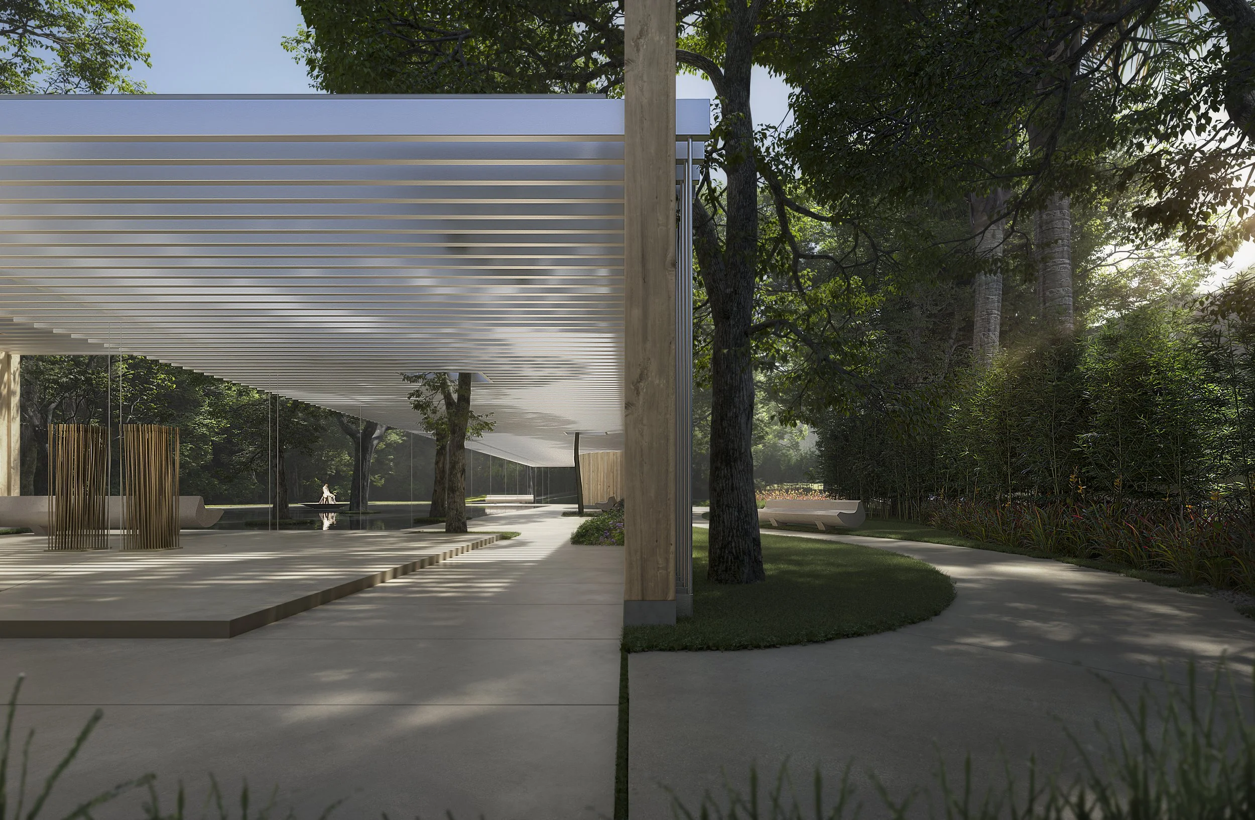 A modern outdoor pavilion with slatted roof, surrounded by trees, benches, and a walking path in a lush green park.