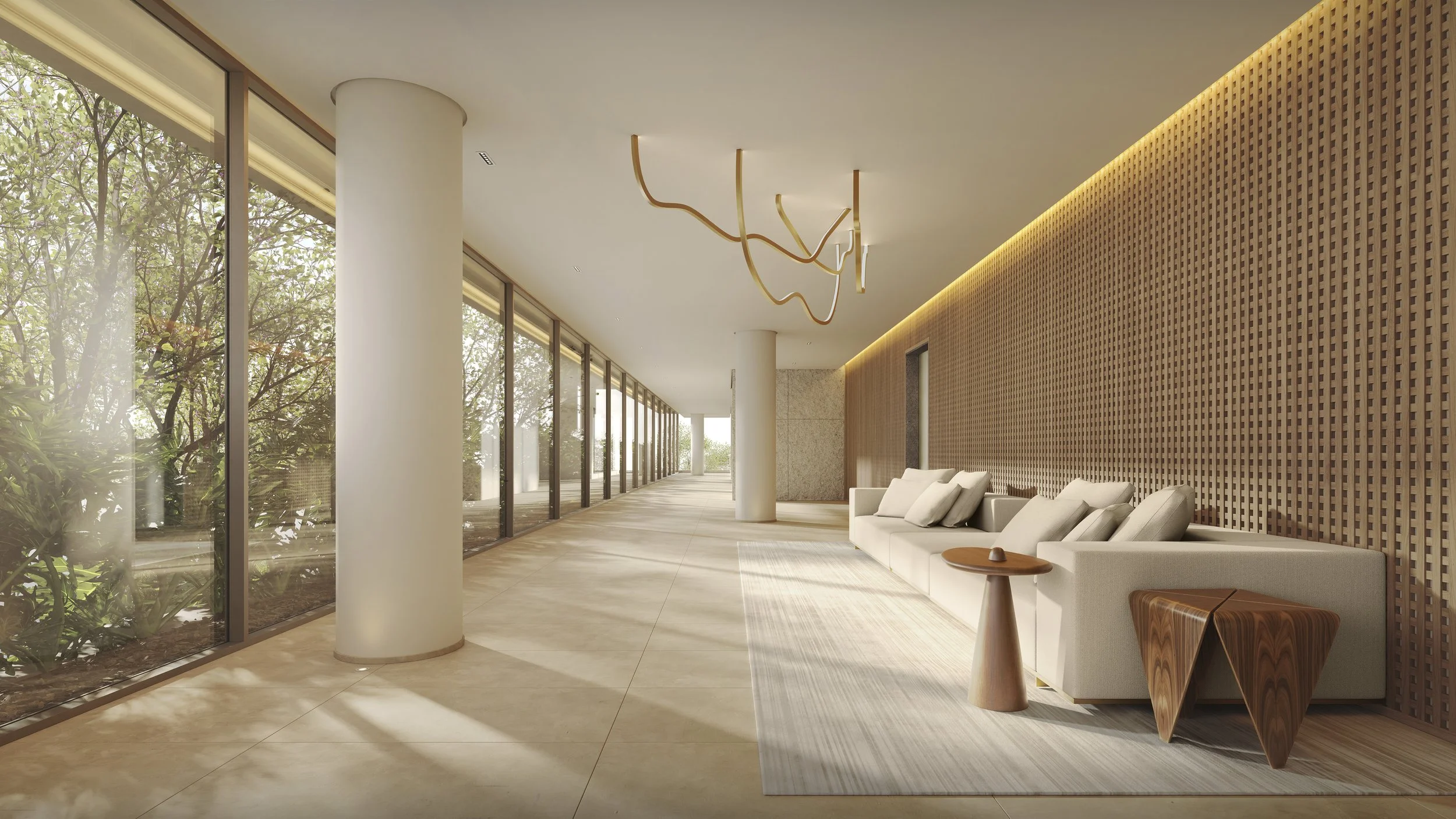 Modern lobby with large glass windows, beige tile flooring, a white sofa with multiple pillows, two wooden side tables, and a decorative wooden panel wall with soft lighting.