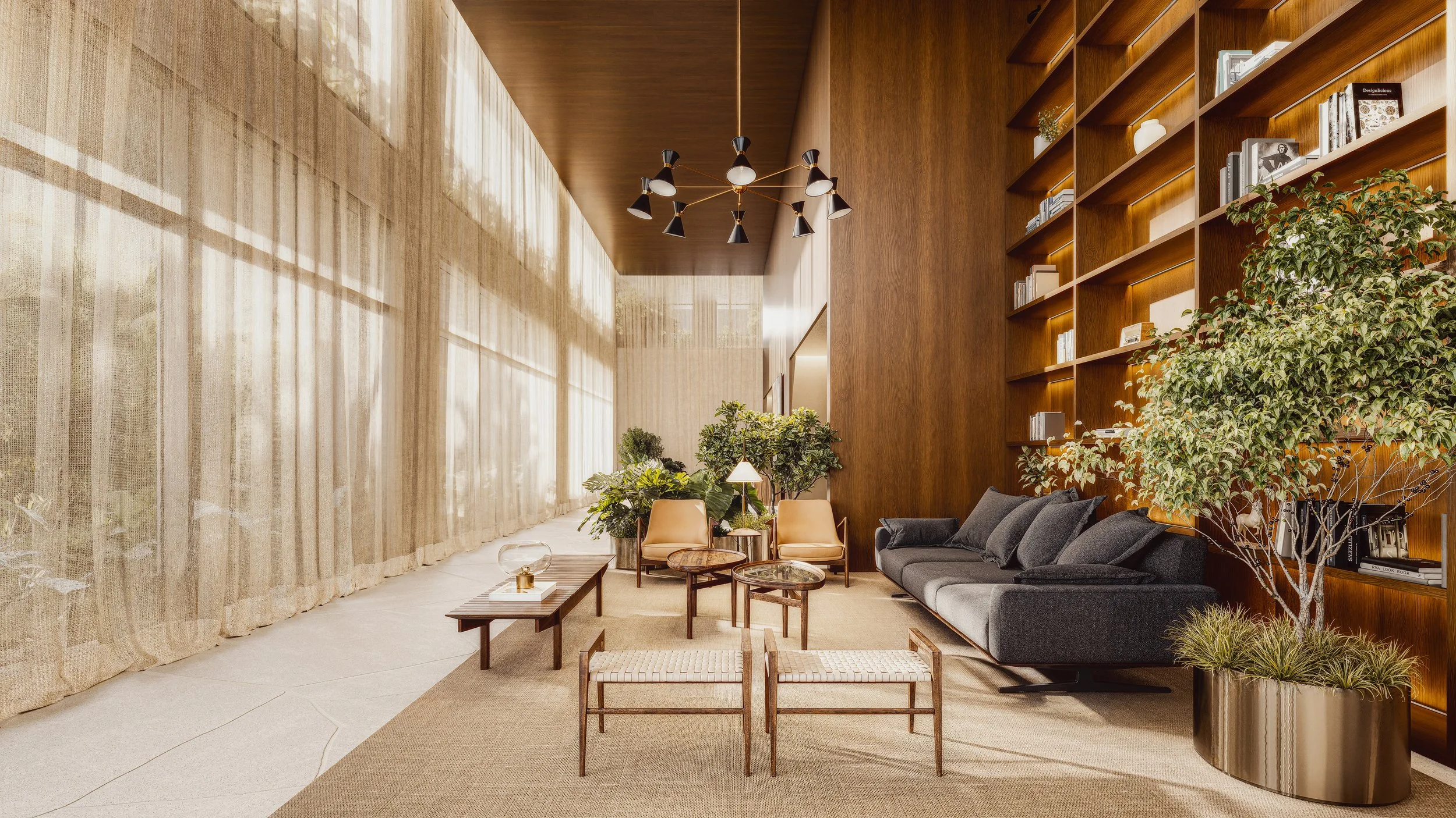 Modern living room with wooden paneling, a dark gray sofa, beige chairs, and tall windows with sheer curtains, decorated with indoor plants and a unique black chandelier.