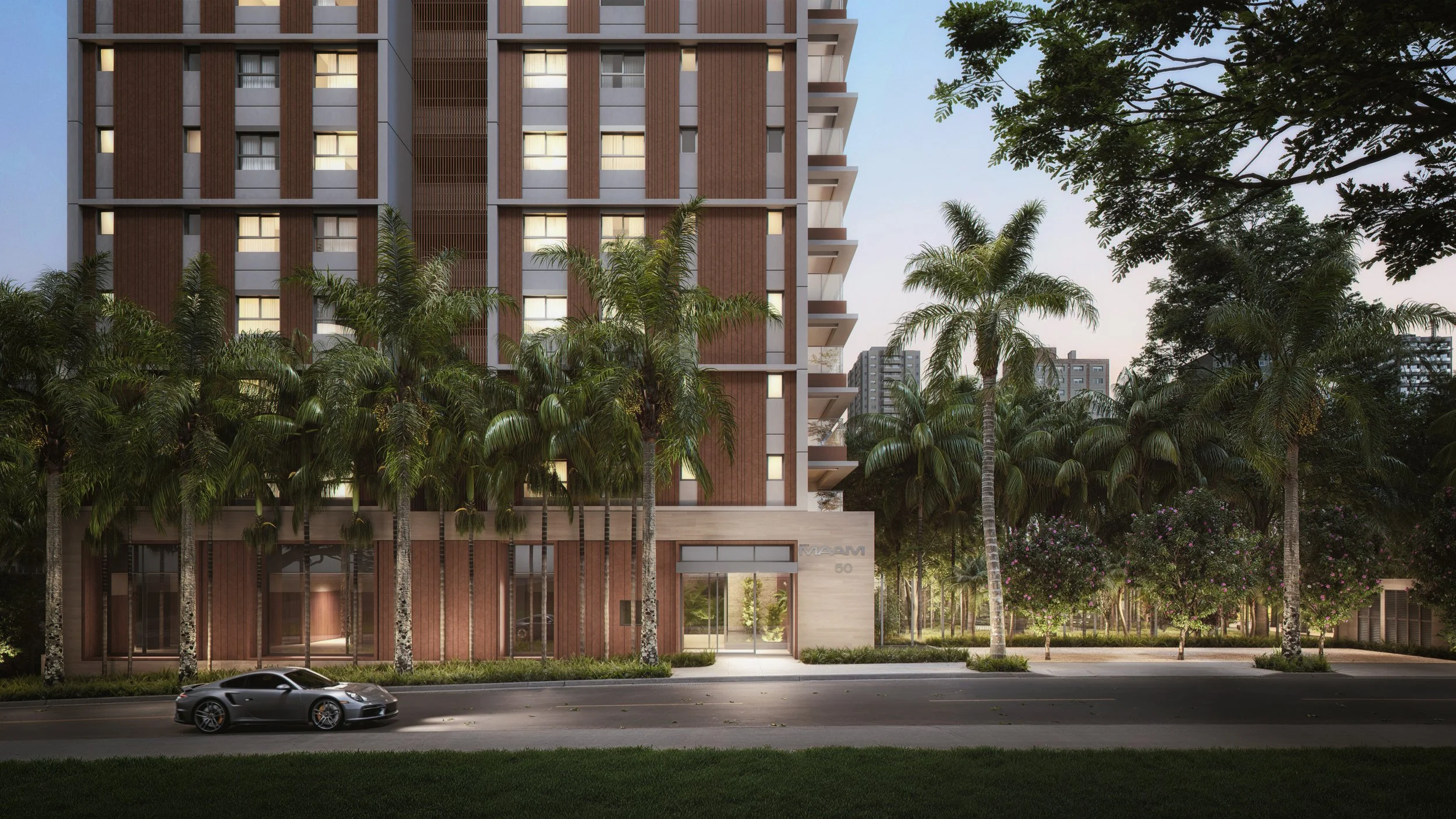Modern multi-story residential building with wooden and concrete elements, surrounded by palm trees and a street with a black sports car parked in front, during dusk.