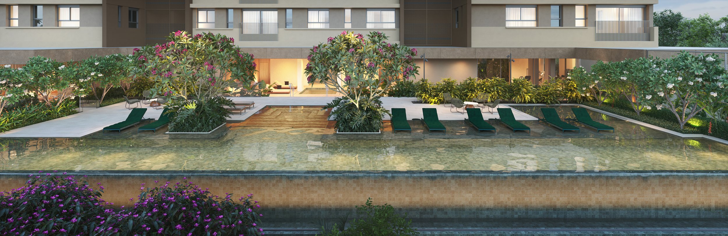 A residential building with a swimming pool in the foreground, surrounded by green trees and plants, with lounge chairs beside the pool.