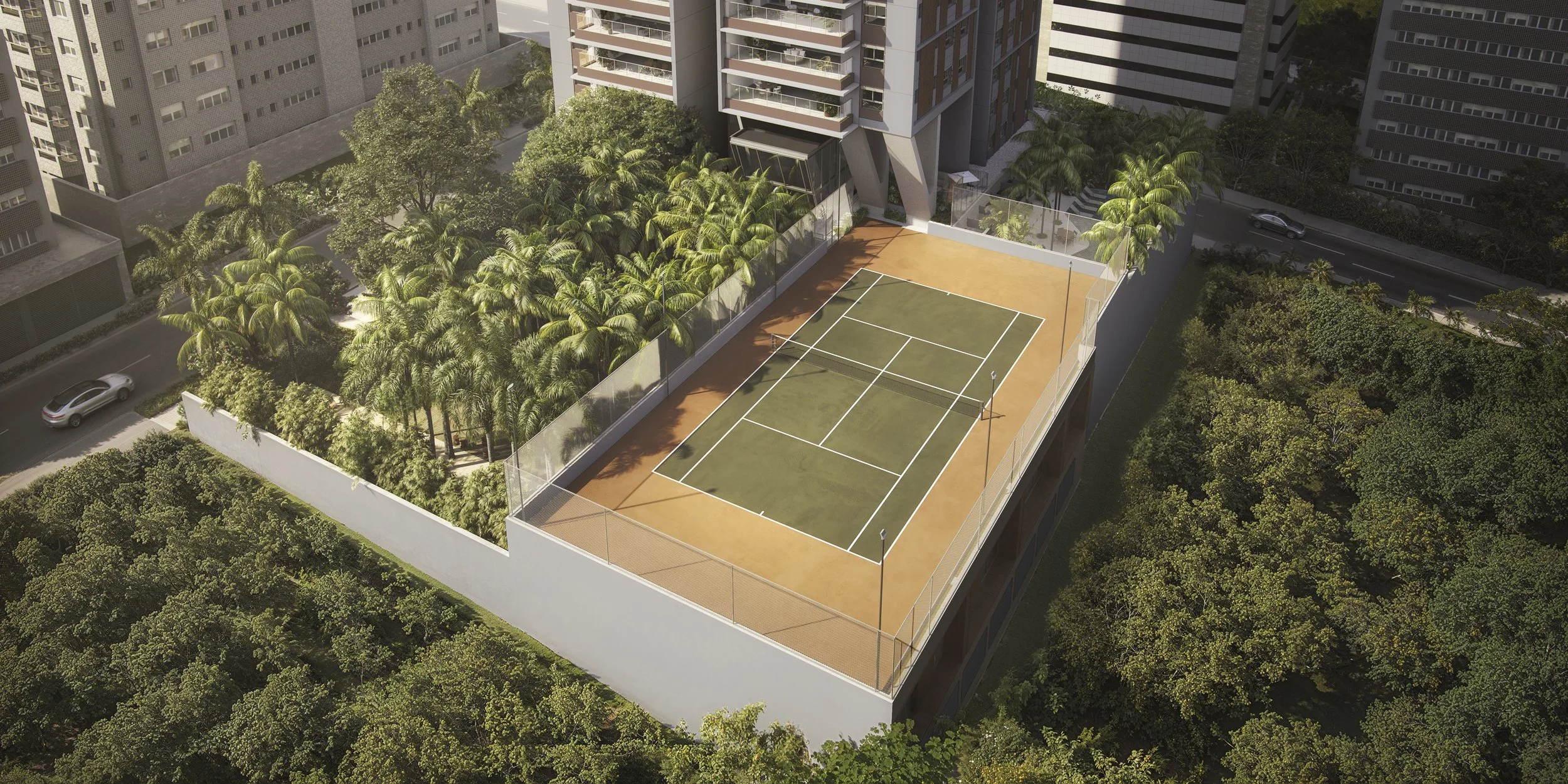 A rooftop tennis court surrounded by a glass fence on a high-rise building, with lush green trees and neighboring buildings in the background.