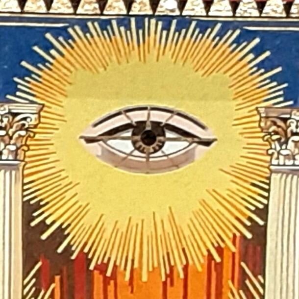 The all-seeing eye of God - the Great Architect of the Universe in Freemasonry.

The forget-me-not was first used as a Masonic emblem in Germany in the 1920s. Since World War II it is sometimes worn in remembrance of all who have suffered in the name