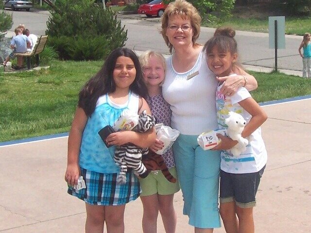 Connie Zimmerman stands with BeyondHome youth