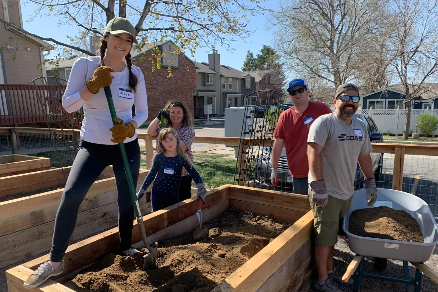 BeyondHome Volunteers building raised gardens for residents