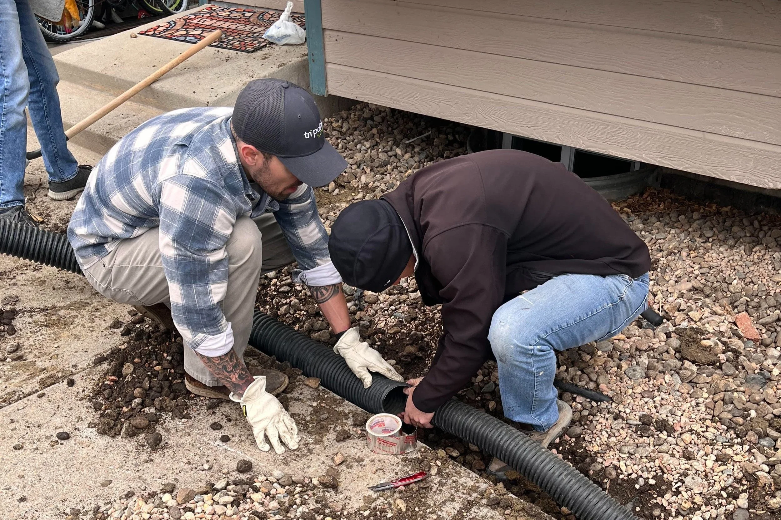BeyondHome volunteers assisting with maintenance