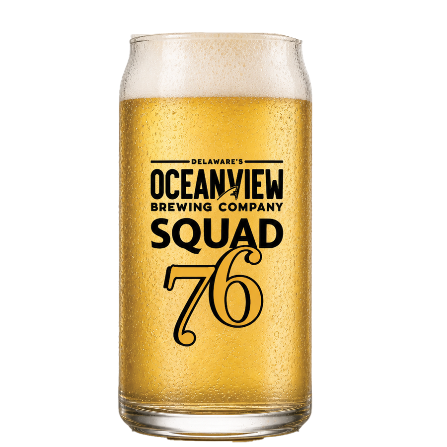 A glass of beer with condensation on the outside, featuring the logo of Delaware's Oceanview Brewing Company, Squad 76.