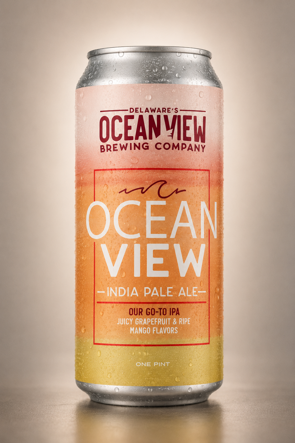 A can of Ocean View India Pale Ale from Delaware's Ocean View Brewing Company, with a layered pink, orange, and yellow label and condensation droplets.