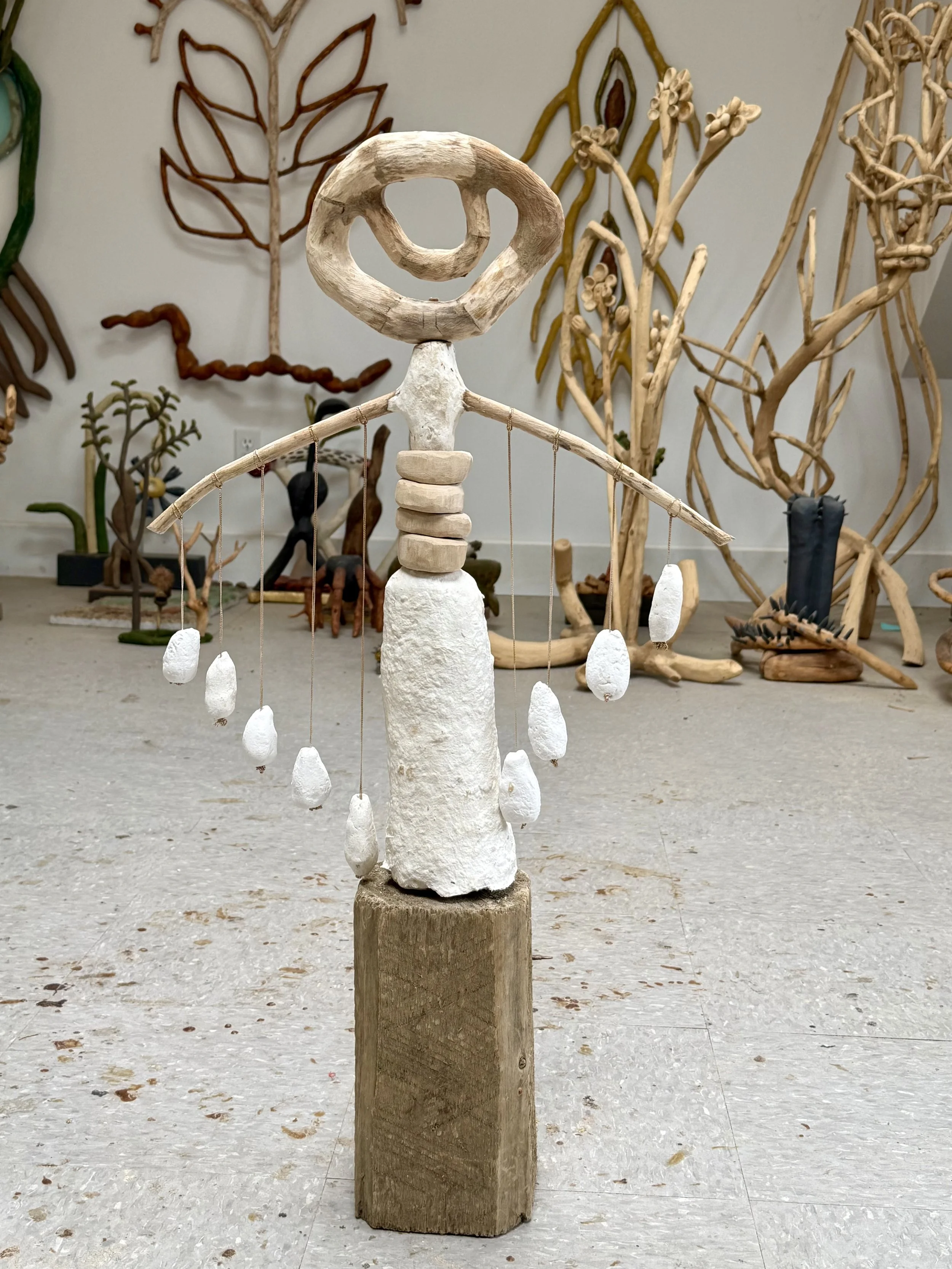 "The Gathering",, 2026, wood, paper clay with silk thread.