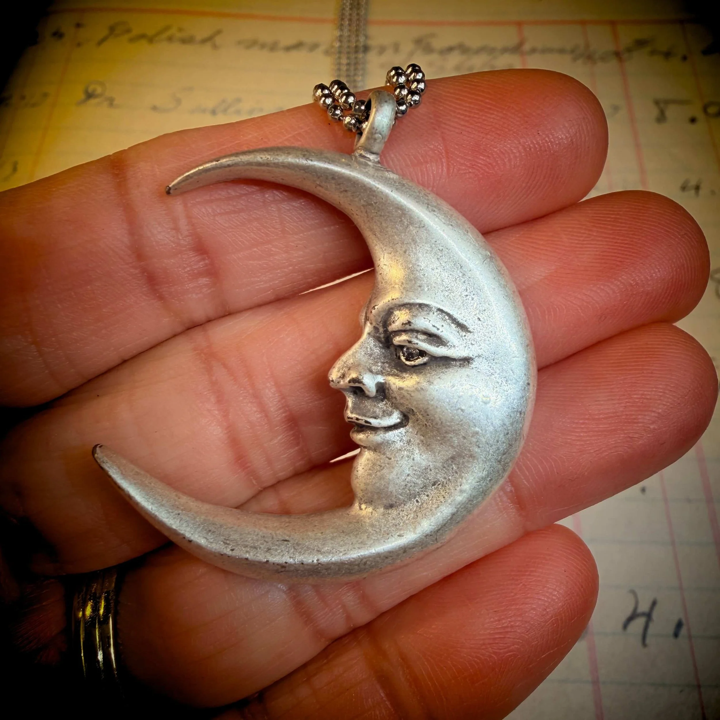 vintage-style-silver-man-in-the-moon-necklace-reflection 1.jpg