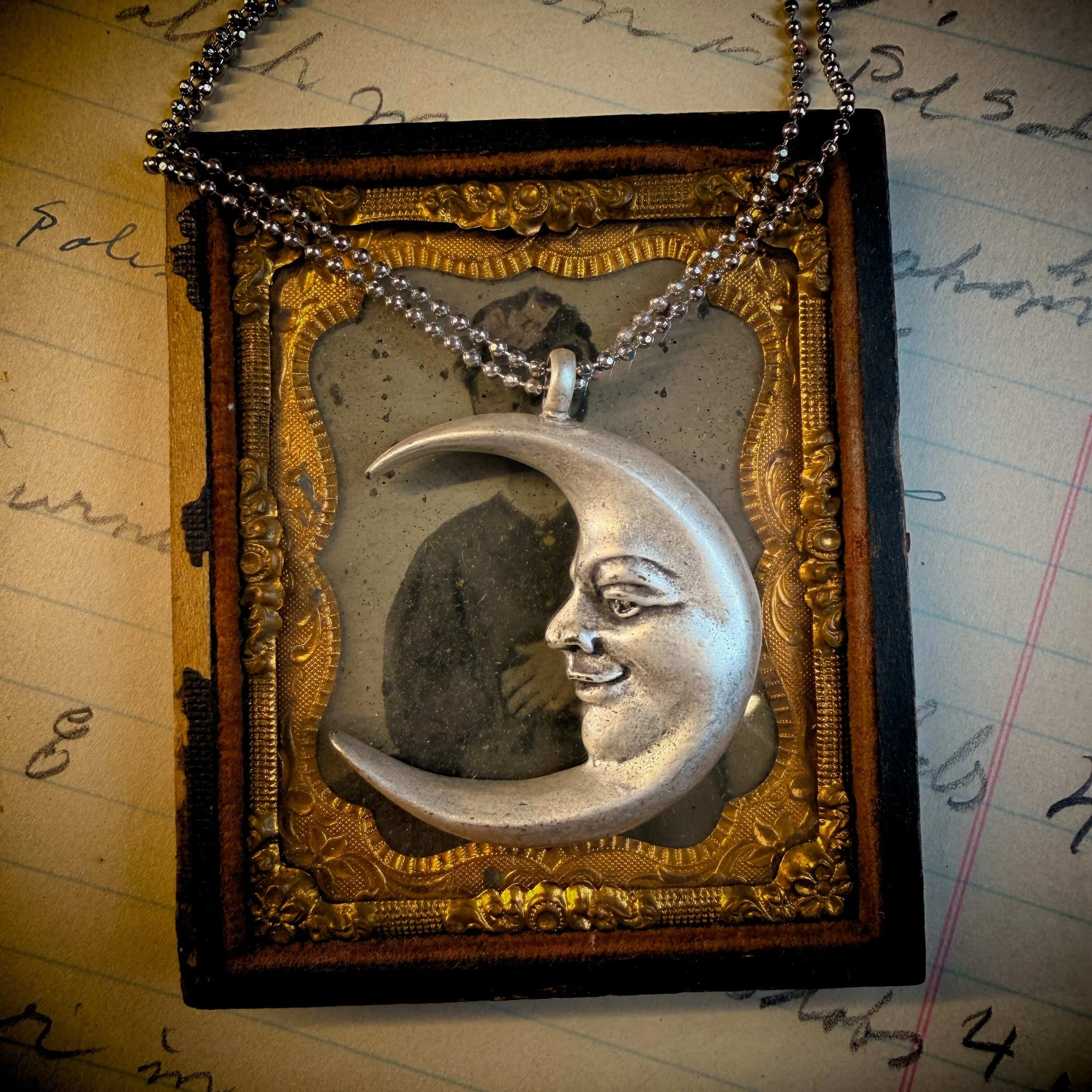 vintage-style-silver-man-in-the-moon-necklace-reflection 5.jpg