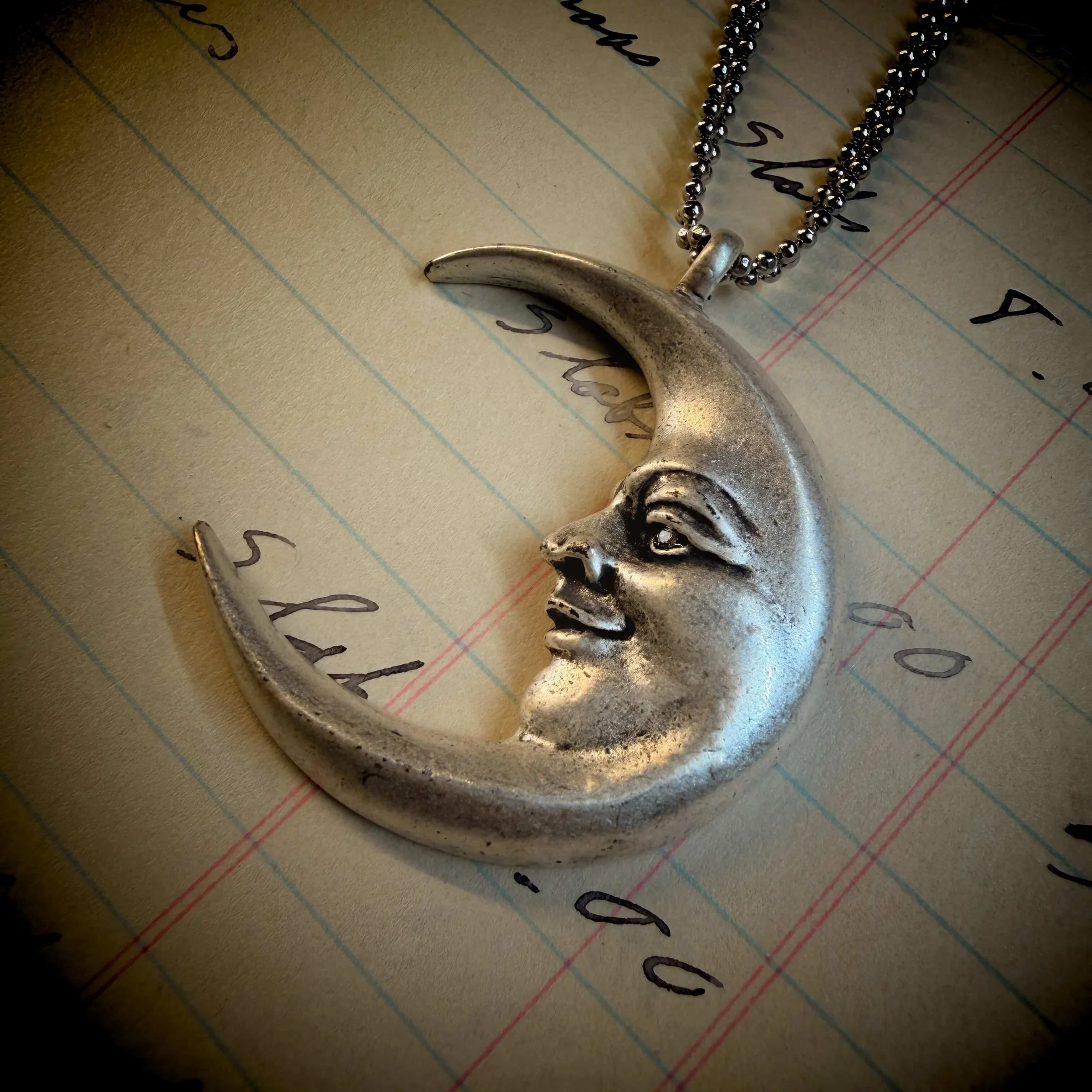 vintage-style-silver-man-in-the-moon-necklace-reflection 10.jpg
