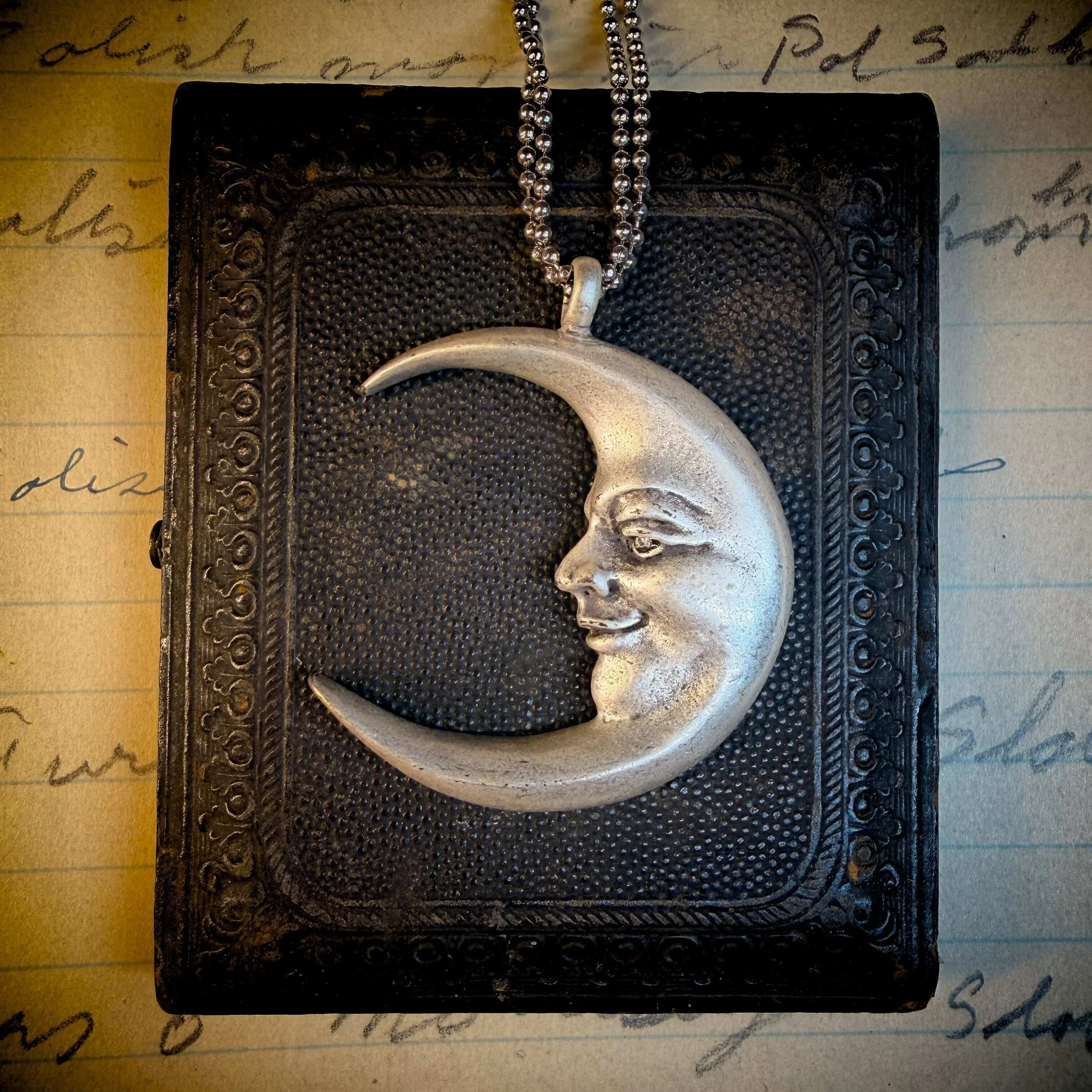 vintage-style-silver-man-in-the-moon-necklace-reflection 2.jpg