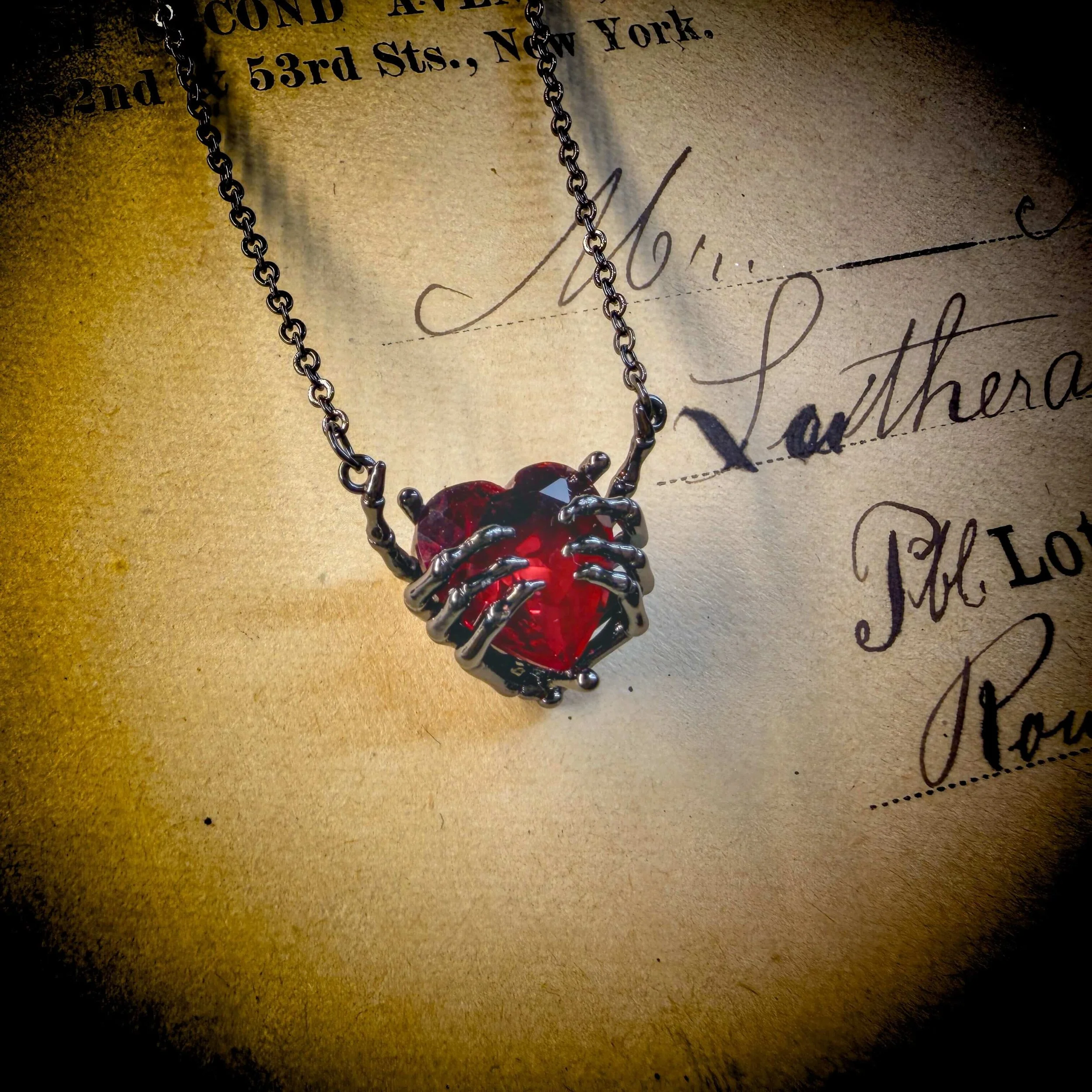 Skeleton Hand Heart Necklace 4.jpg