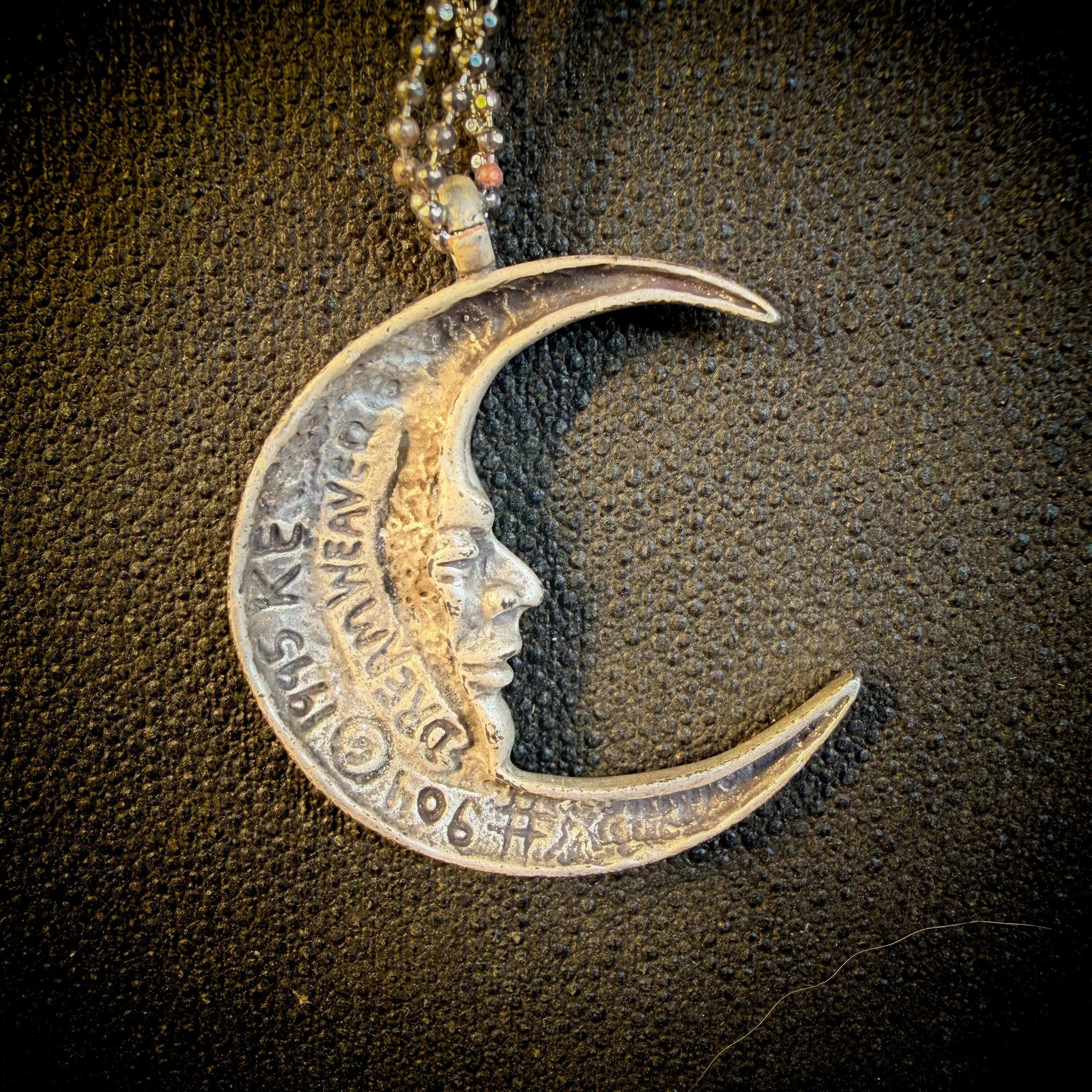 vintage-style-silver-man-in-the-moon-necklace-reflection 11.jpg