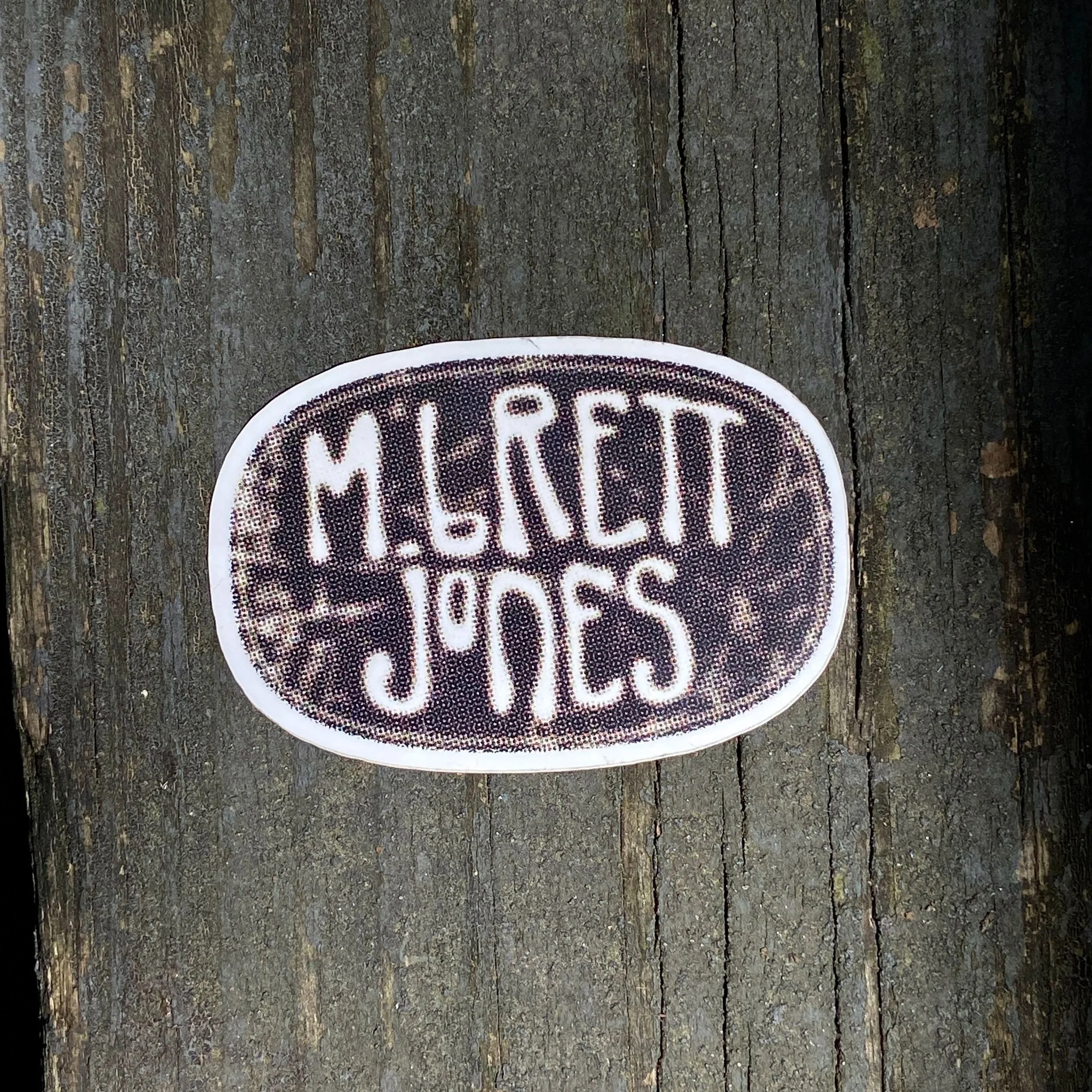 sticker on weathered wood