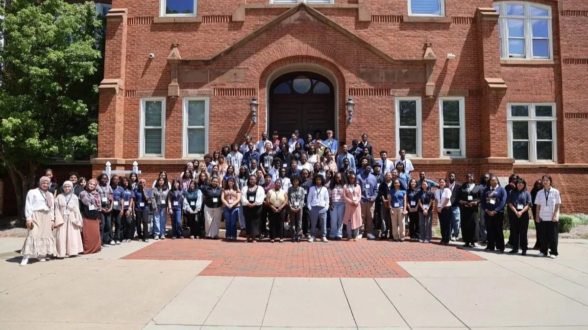 College freshman stand for a group picture at JCSU.