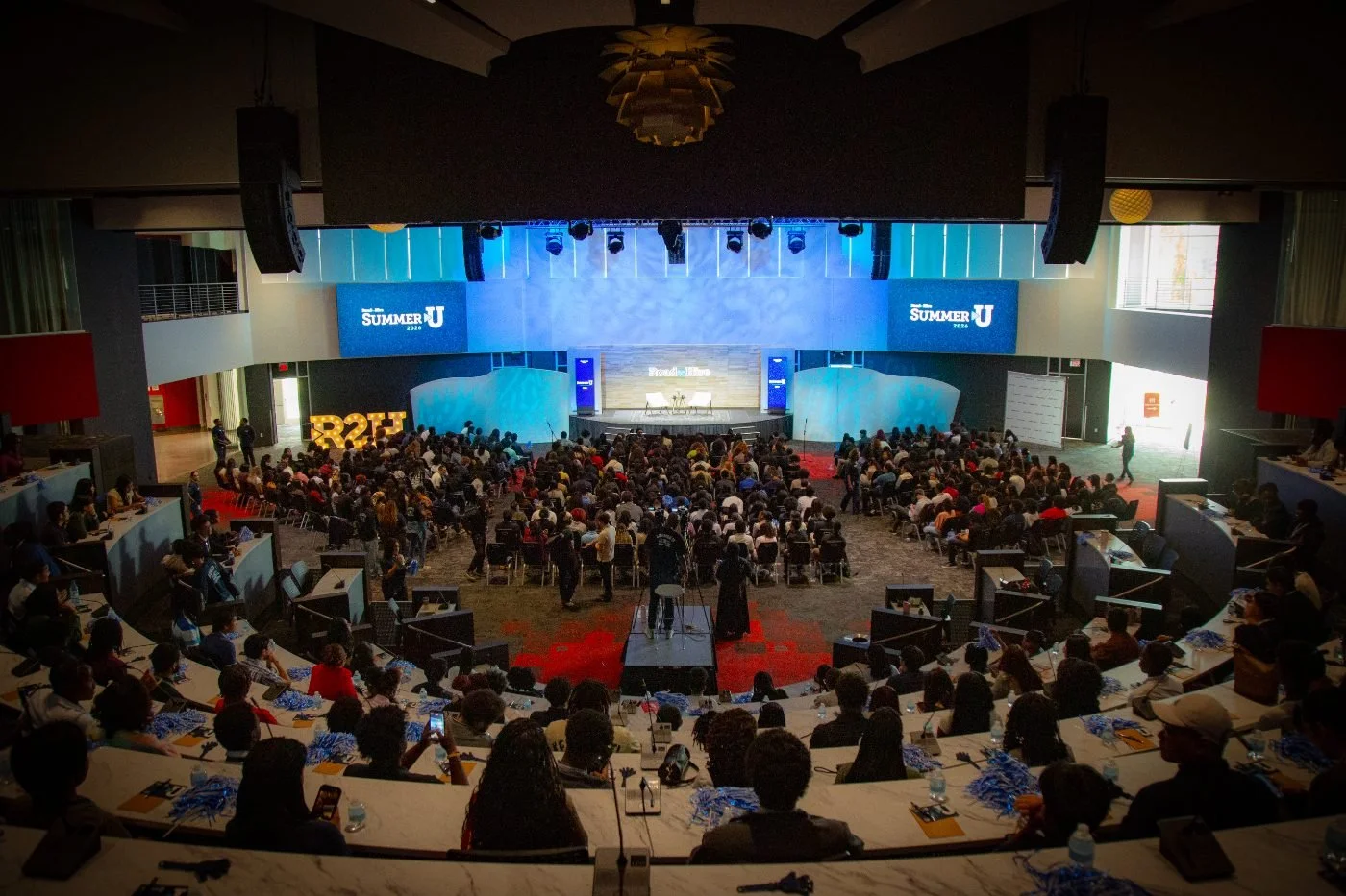Zoom our view of the Road Ahead arena and stage filled with Road to Hire participants