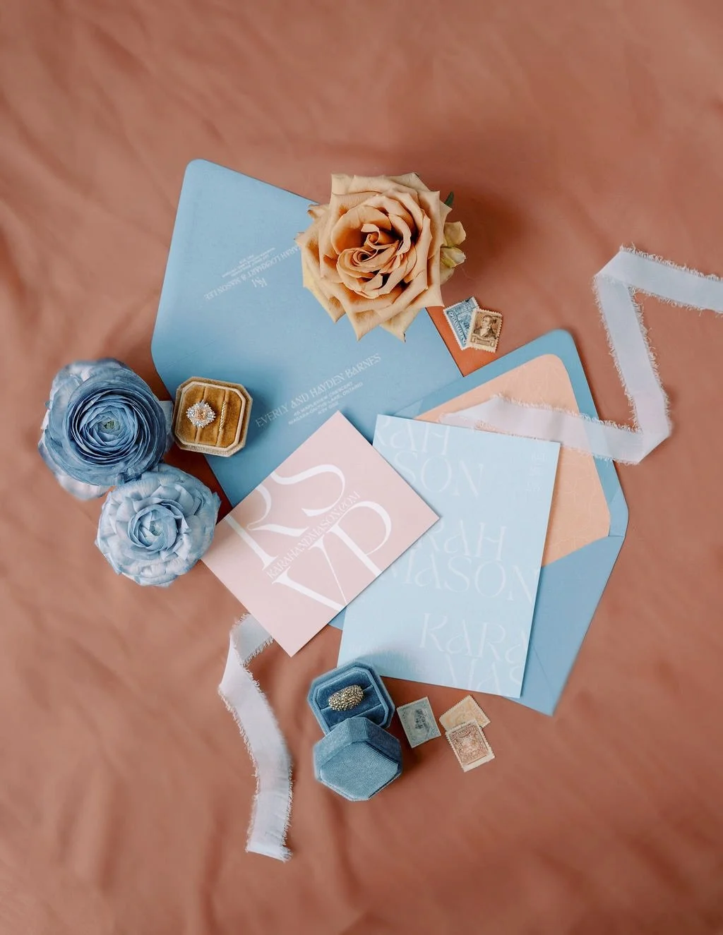Soft blues and warm peach tones&hellip; a little vintage romance with a modern twist. Layered textures, delicate ribbons and custom details make this suite feel like a love letter before the wedding even begins 💌

Photography/Art Direction @geminiph