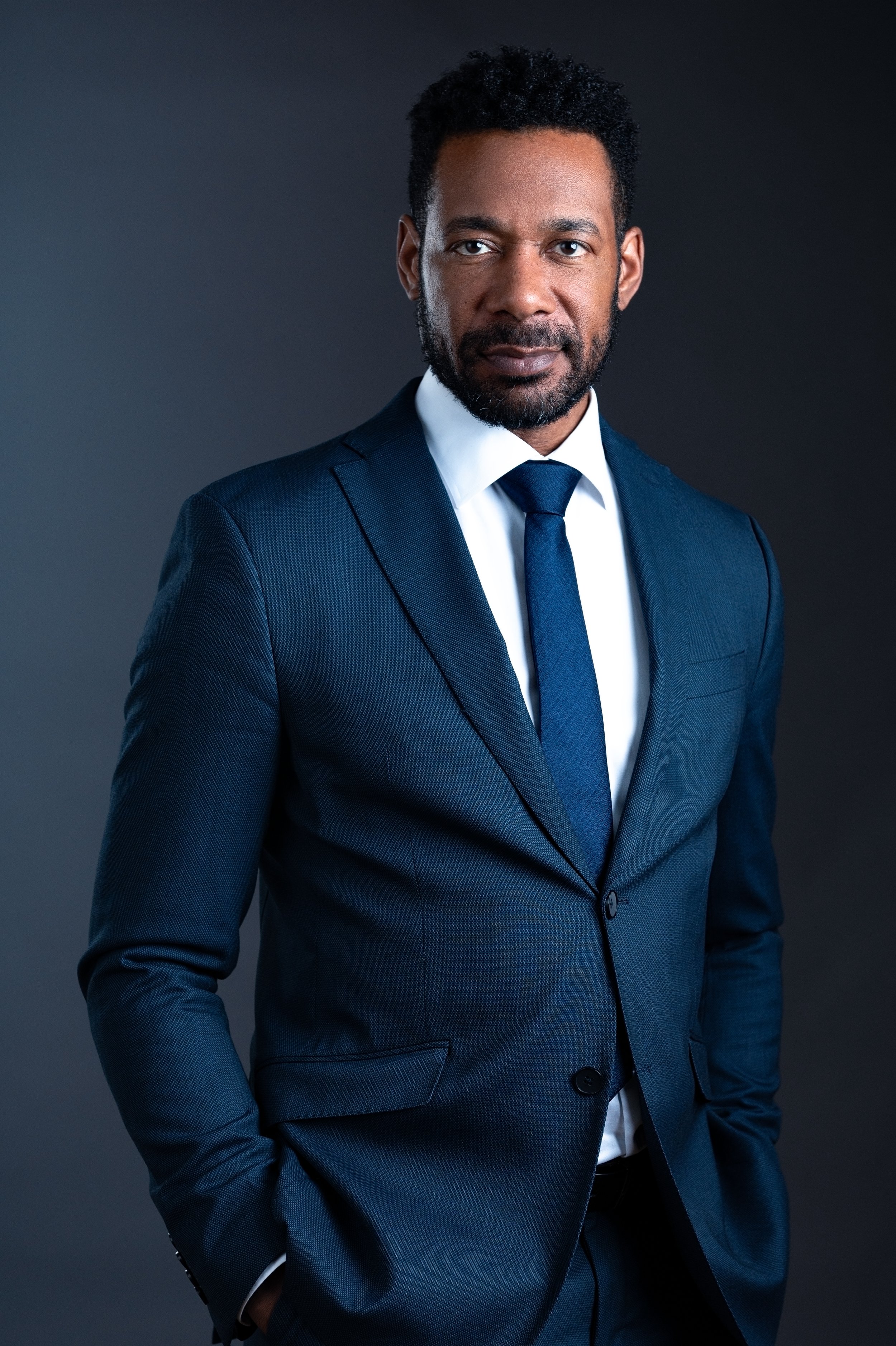 A professional corporate headshot of a Toronto executive showcasing correct business lighting and context.