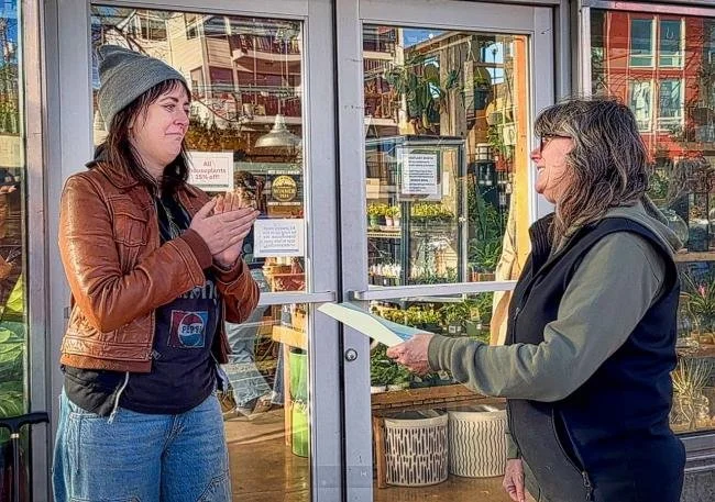 Presenting a check on behalf of WSN and its community to MMPA