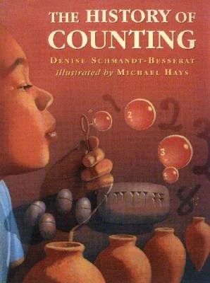 The History of Counting, by Denise Schmandt-Besserat & illustrated by Michael Hays 
Drawing on years of research, a renowned archaeologist traces the evolution of counting. Engrossing and enlightening, this fascinating book introduces children to one