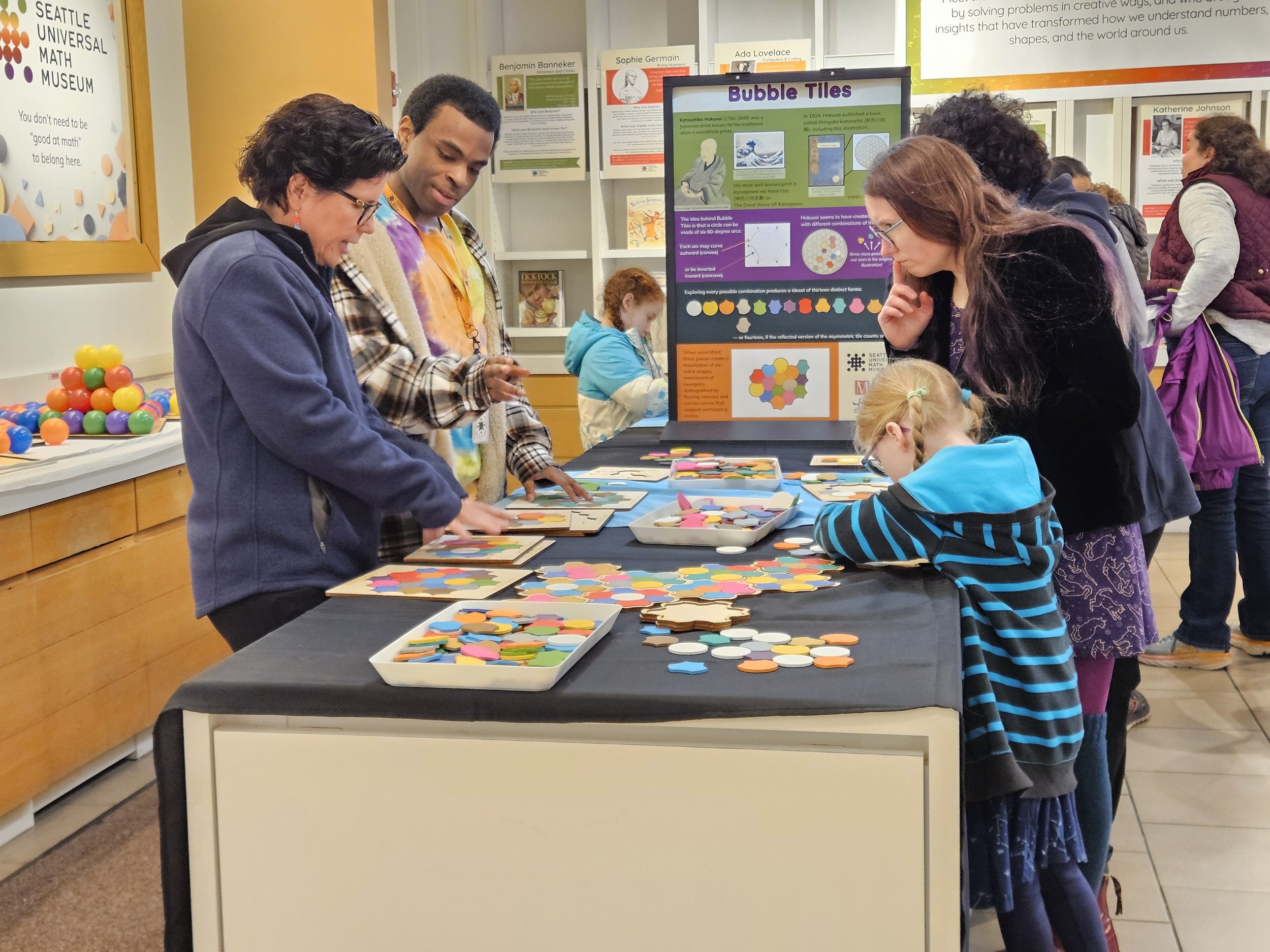 individuals play with bubble tiles