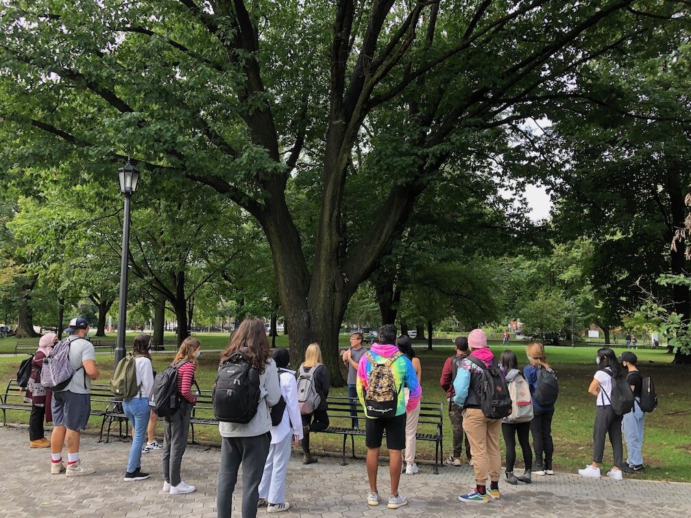 Todd speaking to a class of U of T students about the mature oaks of Queen's Park.