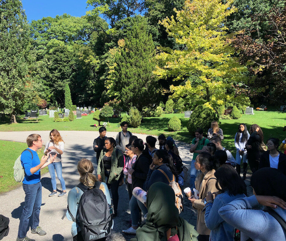 Todd leading a class of University of Toronto students on a tree and ravine walk.