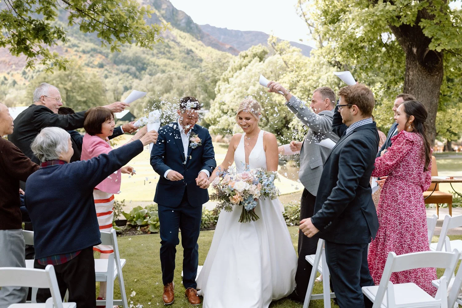 Hydrangea-confetti-petals-being-celebrated-at-a-wedding.jpg