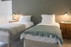 Peaceful bedroom accommodation at D'Álijo Retreat Center, Portugal