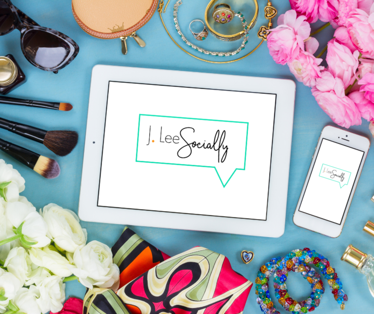Tablet and smartphone displaying 'Lee Socially' logo surrounded by makeup brushes, jewelry, sunglasses, flowers, and decorative accessories on a blue surface. Logo designed by Brim and Bold Creative.
