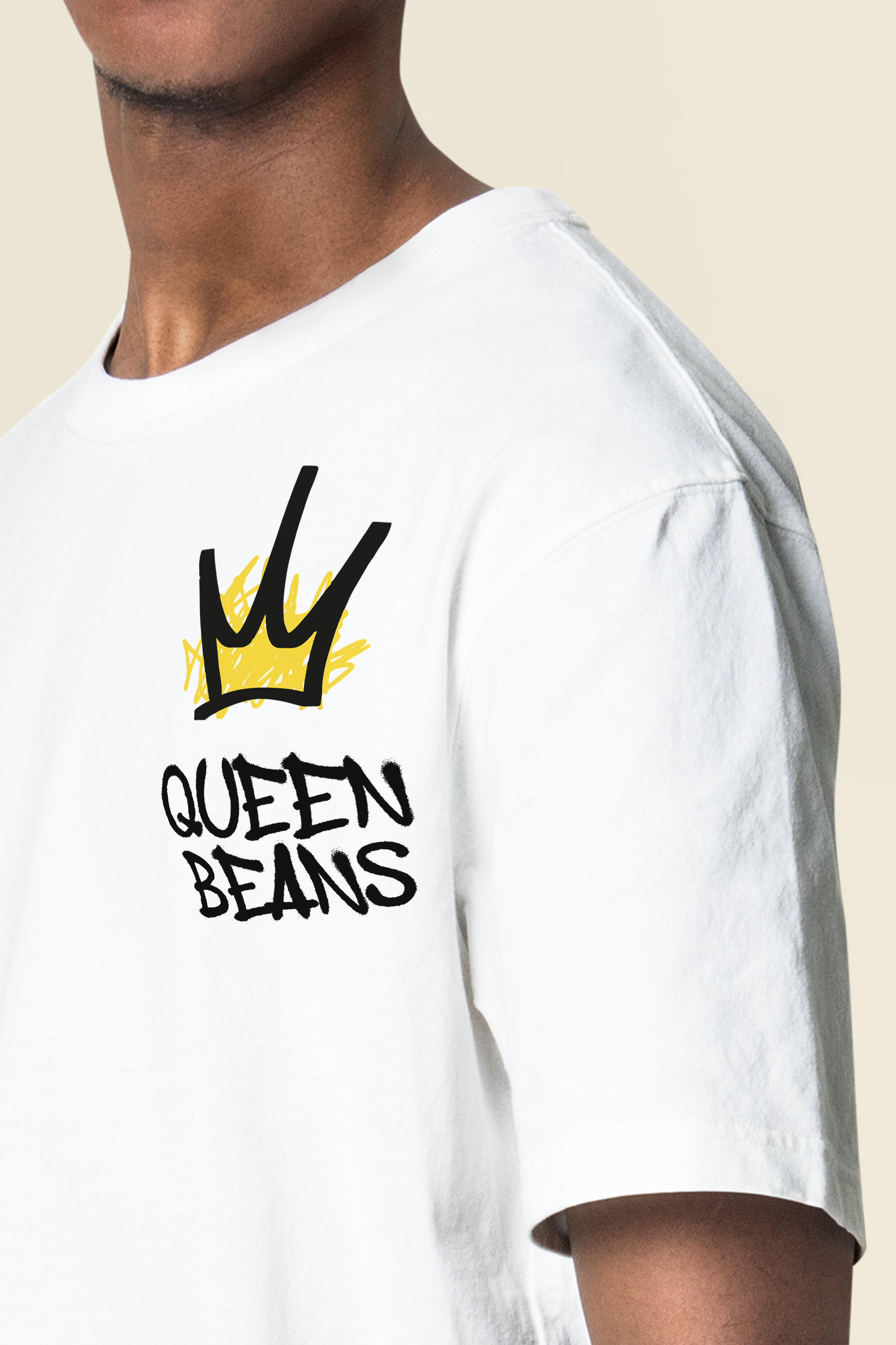 White T-shirt with a black and yellow graphic design featuring a crown and the words 'QUEEN BEANS'. Logo designed by Brim and Bold Creative.