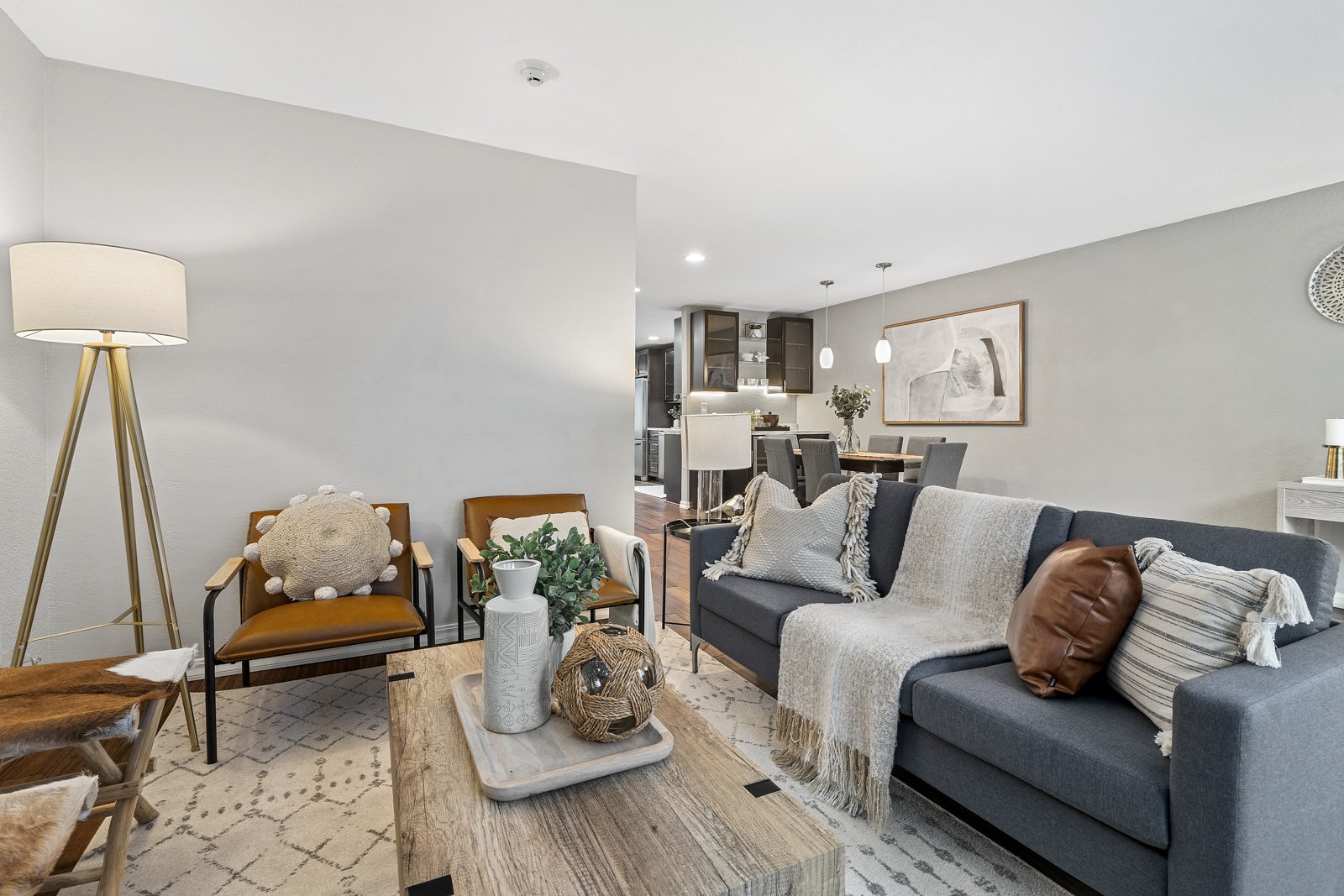 interior of living room with couch, chairs, and coffee table