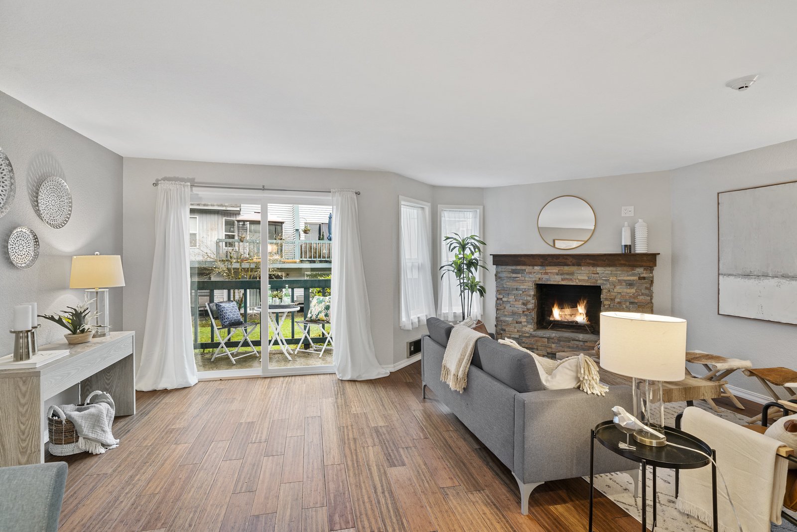 interior of window with couch, fireplace, and french doors