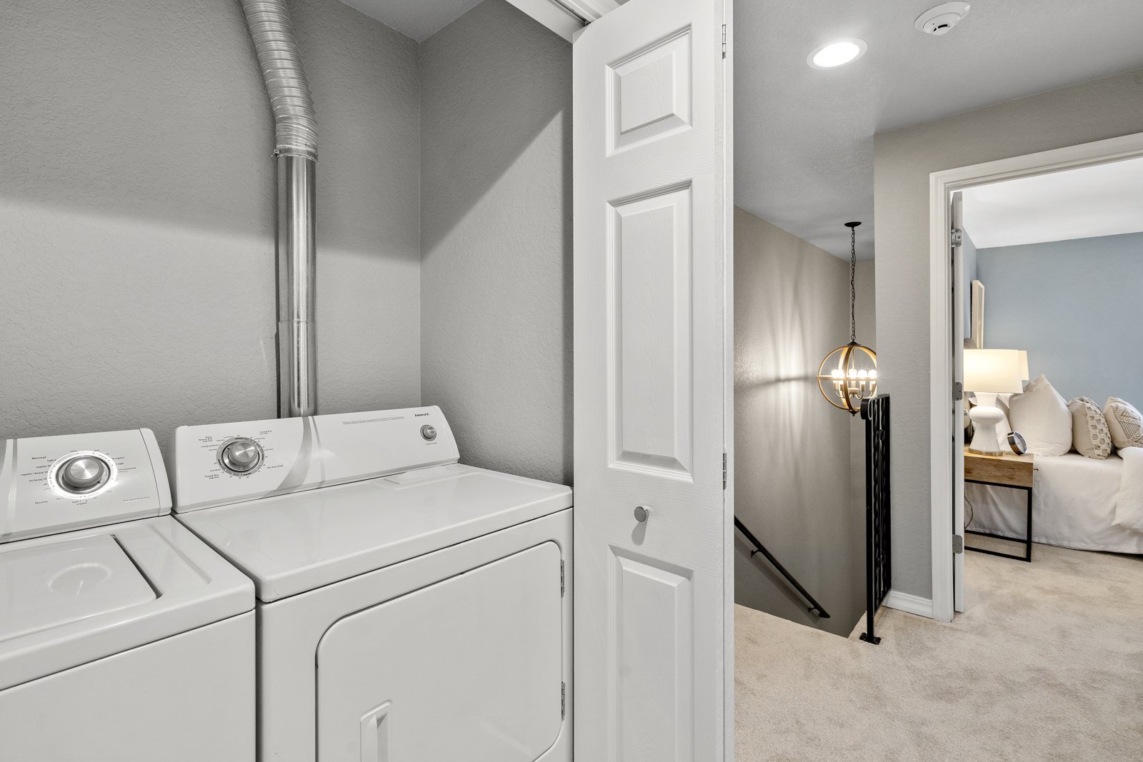 interior of storage closet with washer and dryer