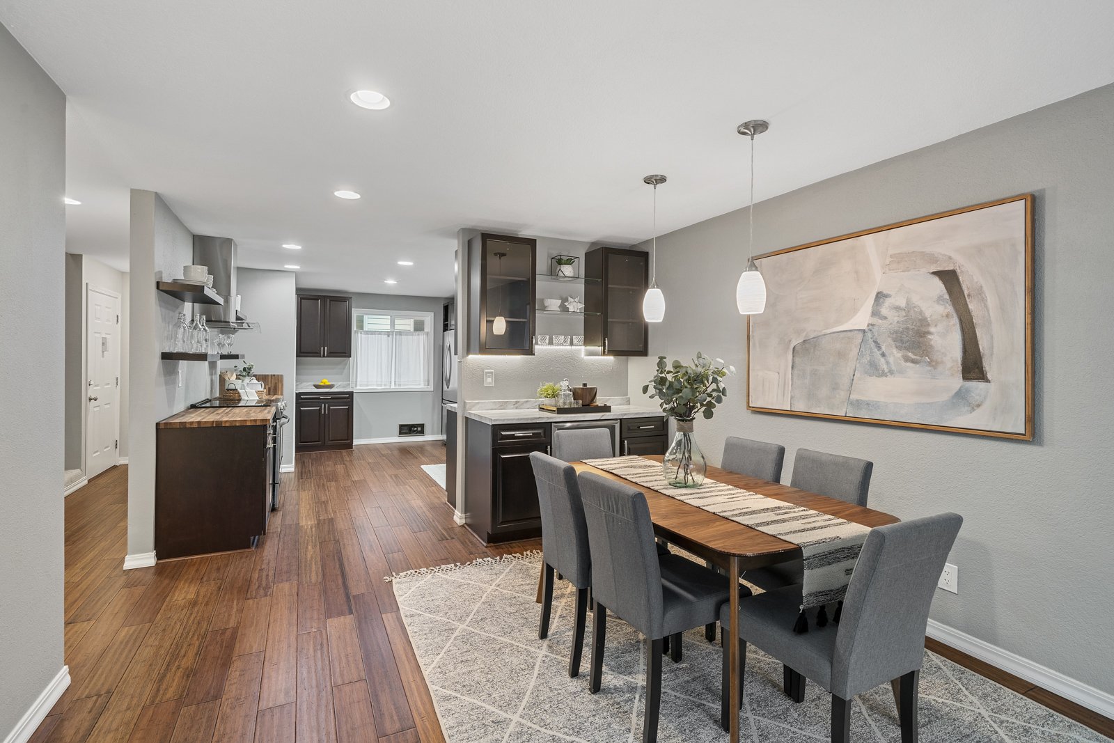 interior of kitchen and dining room with window and dining table
