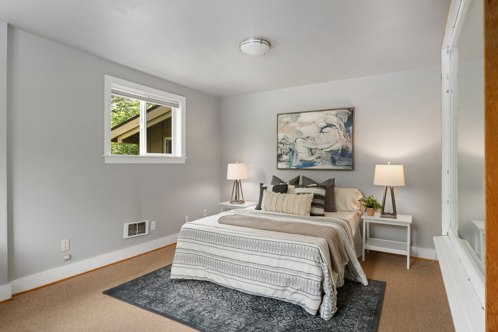 view of the bedroom in whites and grays