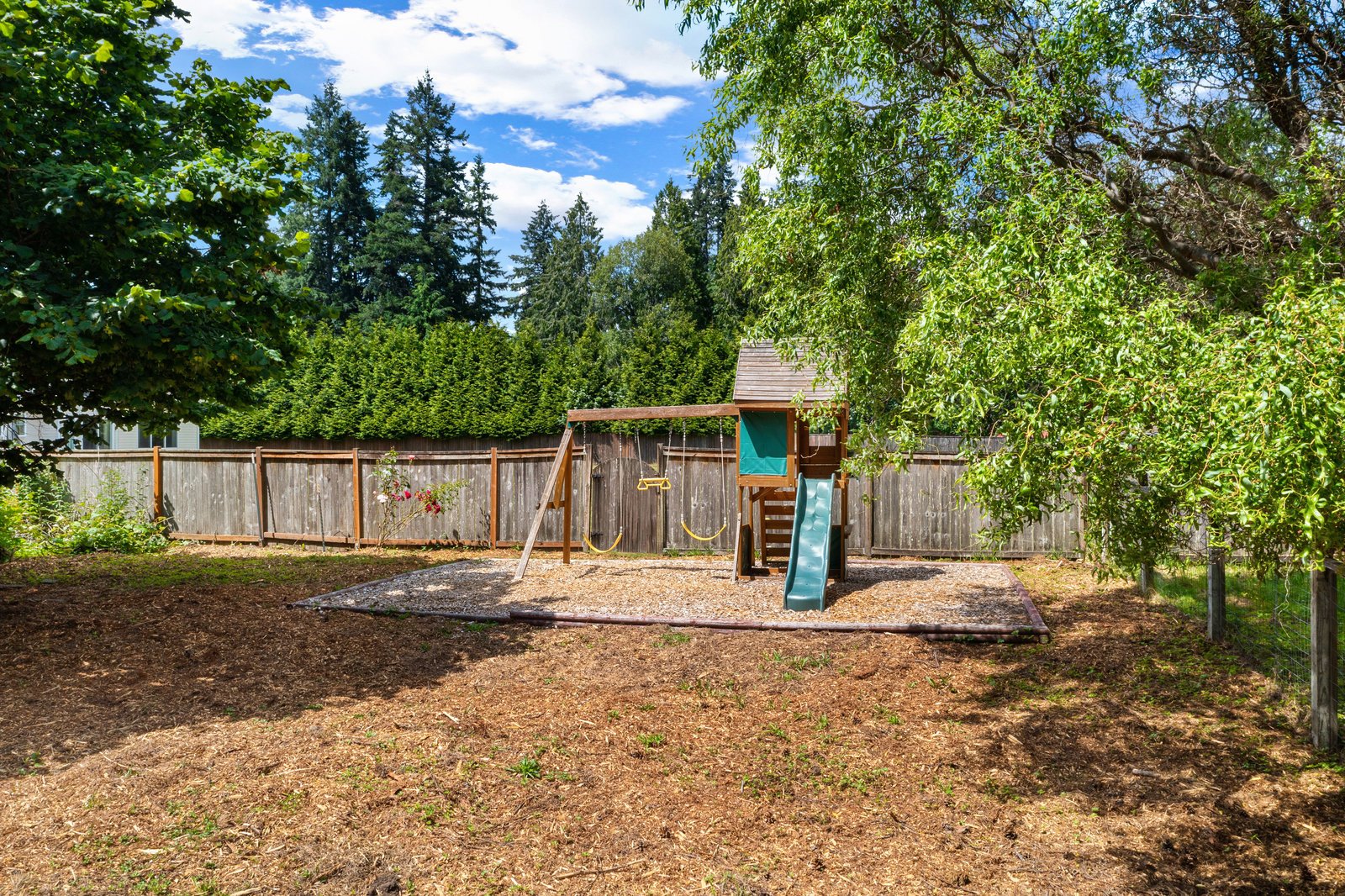 view of the small playground in the yard