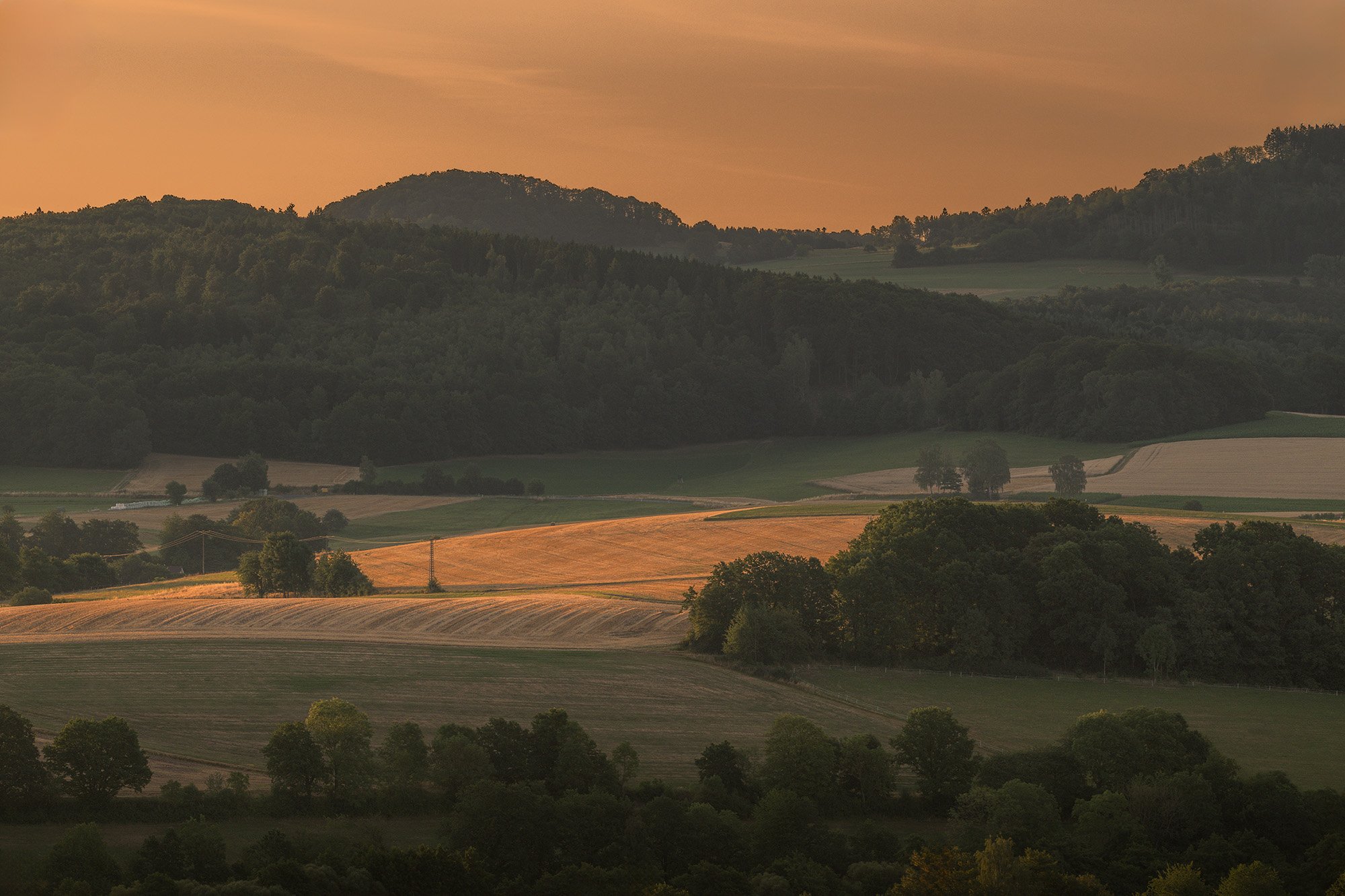 Hessen_Hofbieber_Felder_Berge_Sonnenaufgang_BOLLMANN-BF_web.jpg
