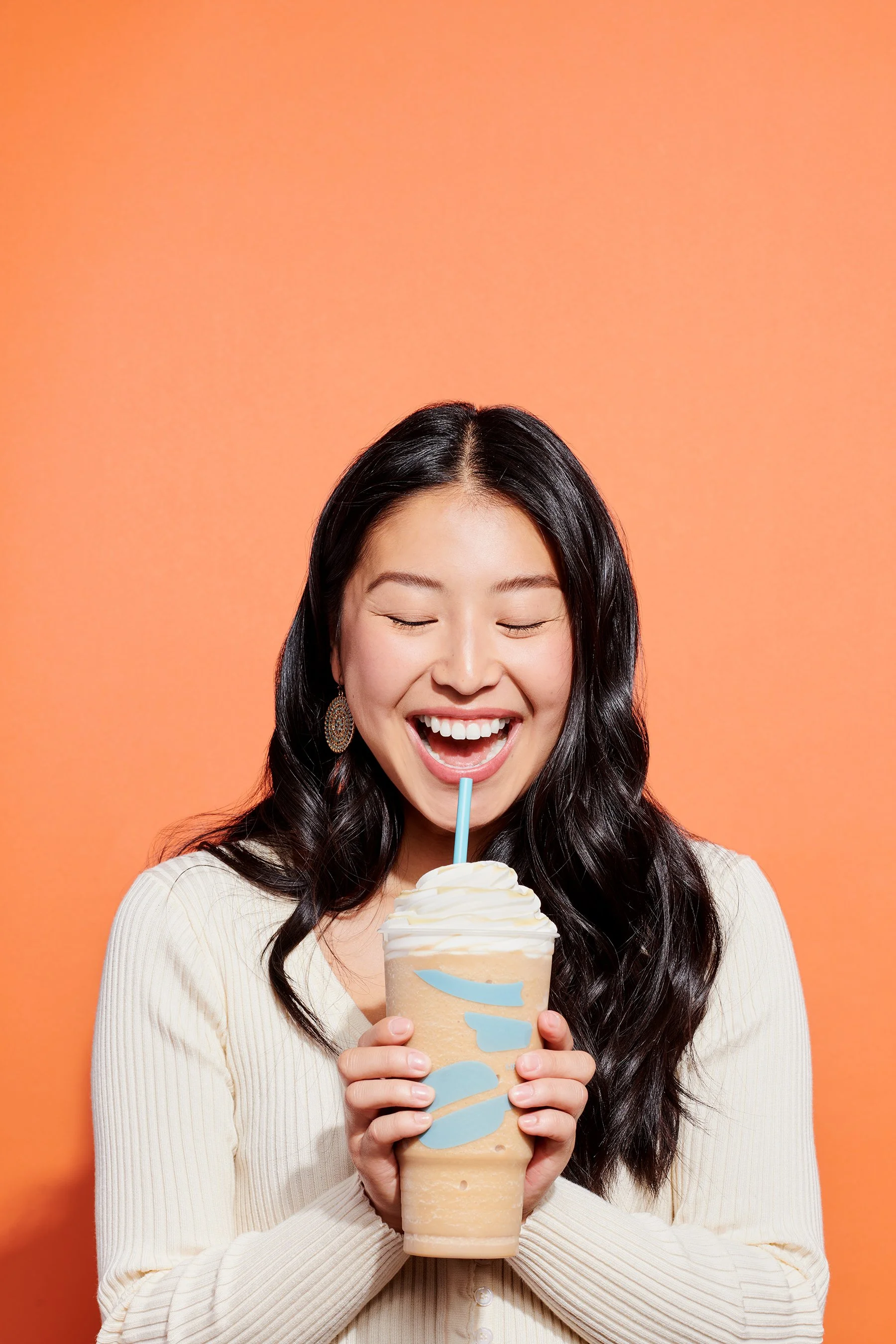 woman drinking frozen caribou coffee