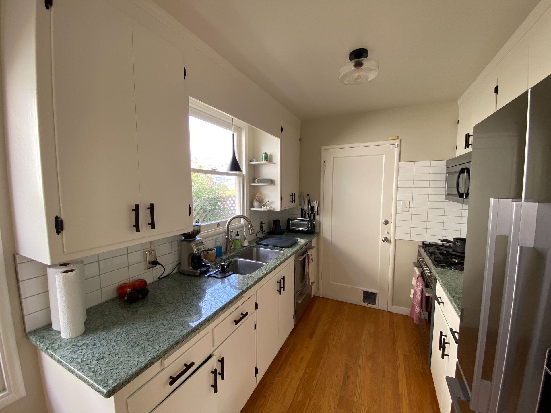 Kitchen with door to attached garage.