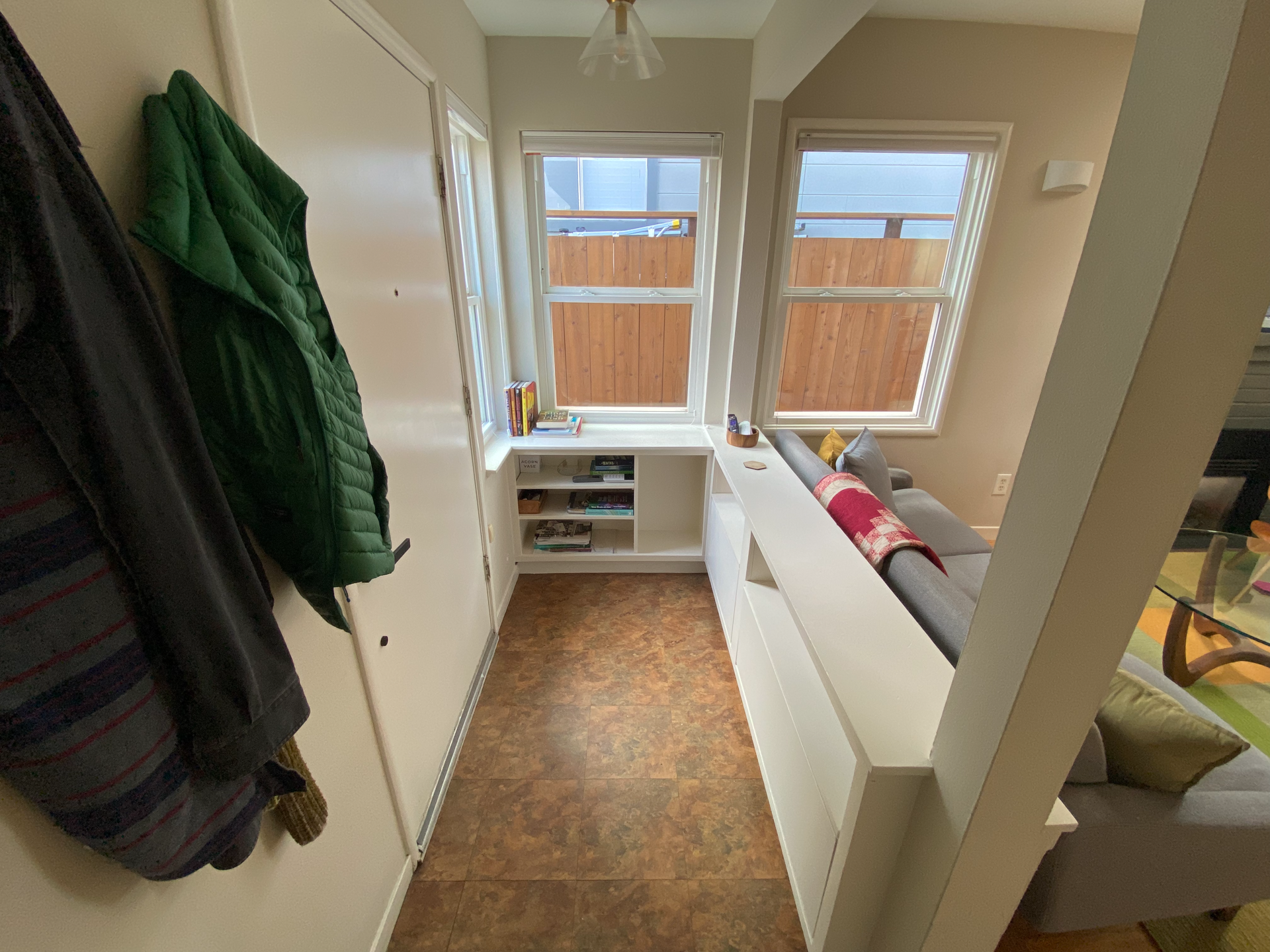 Hallway with hideaway shoe storage.