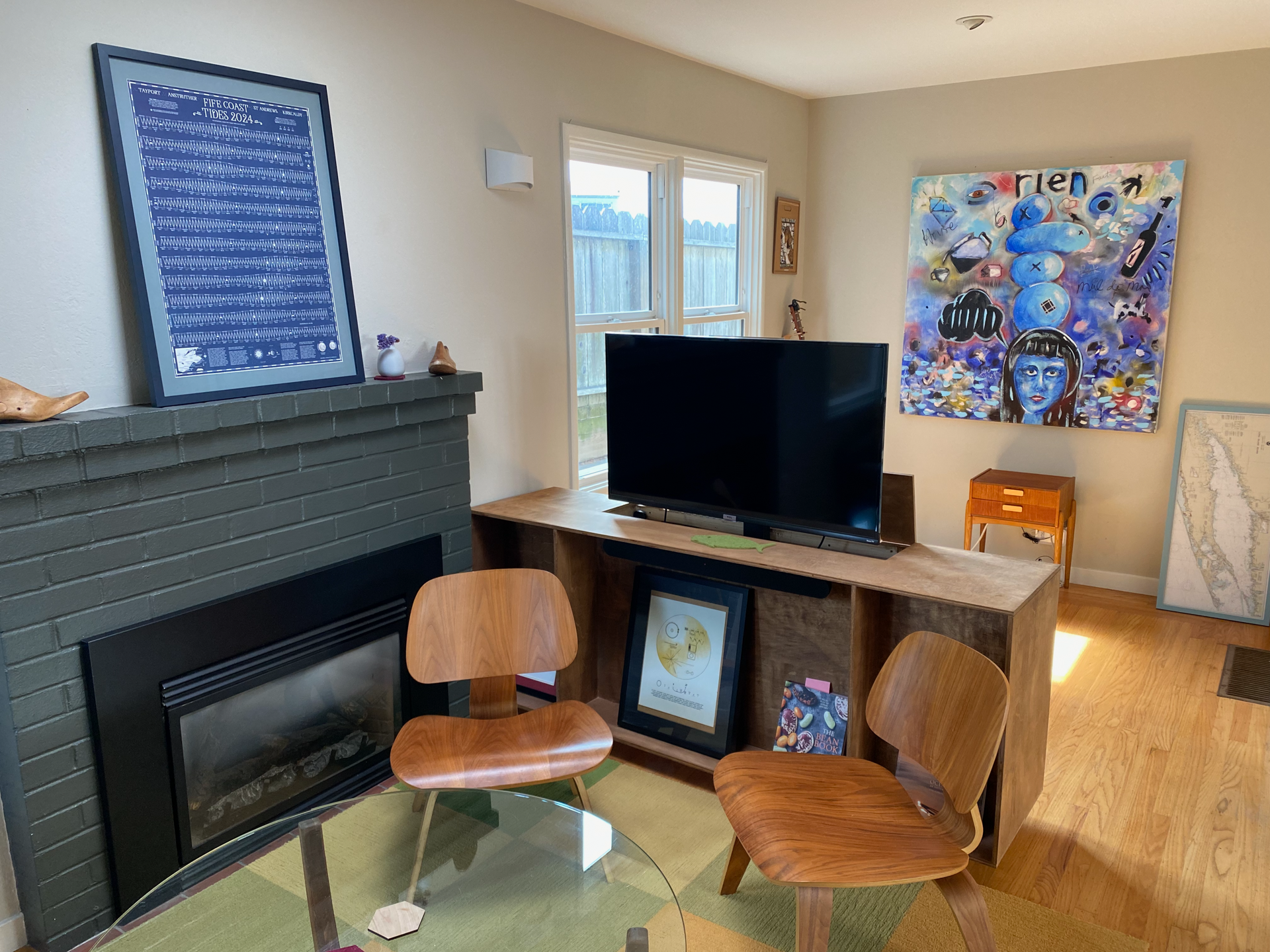 Livingroom with TV up. Remote controlled, silent TV cabinet can remain with house or be removed. (Tenant's choice.)